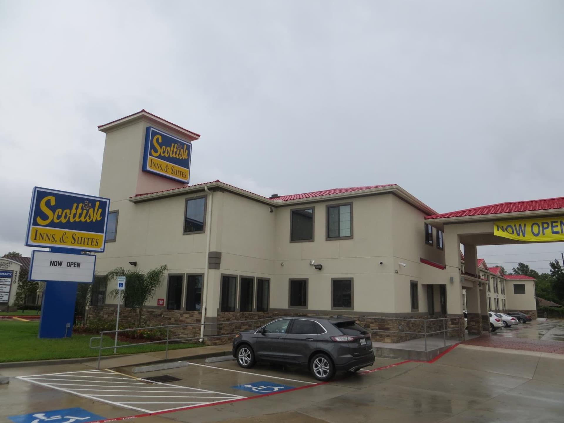 Scottish Inn and Suites featured exterior or lobby in Katy, TX — similar hotel