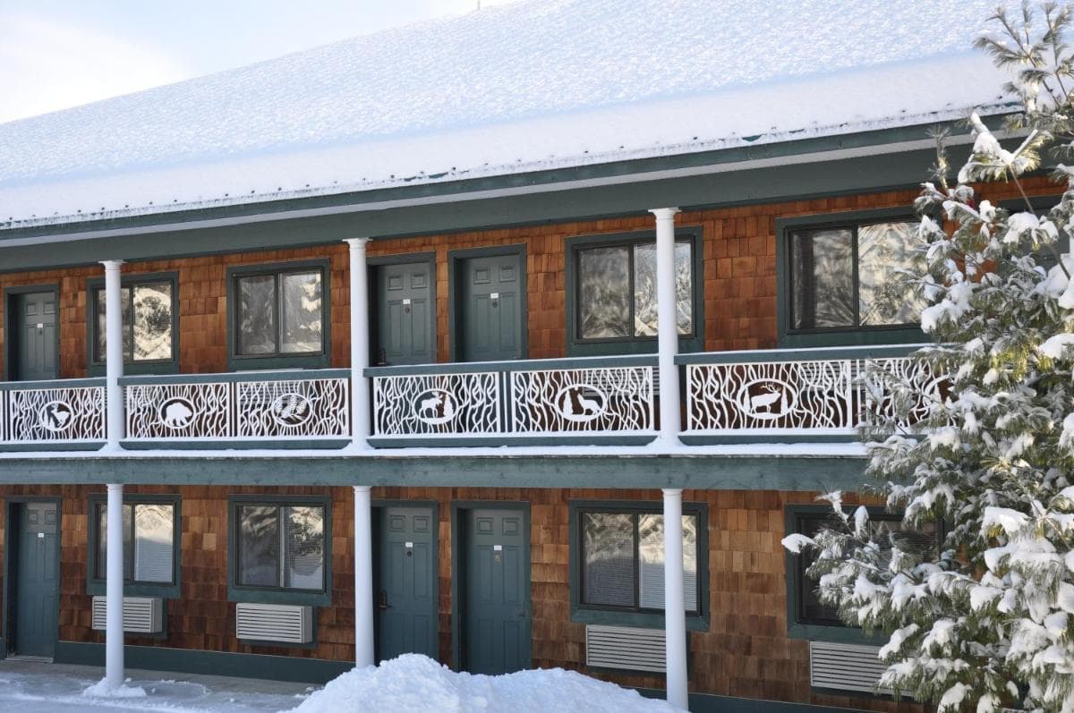 The Legend Cottage Inn featured exterior or lobby in Bellaire, MI — similar hotel