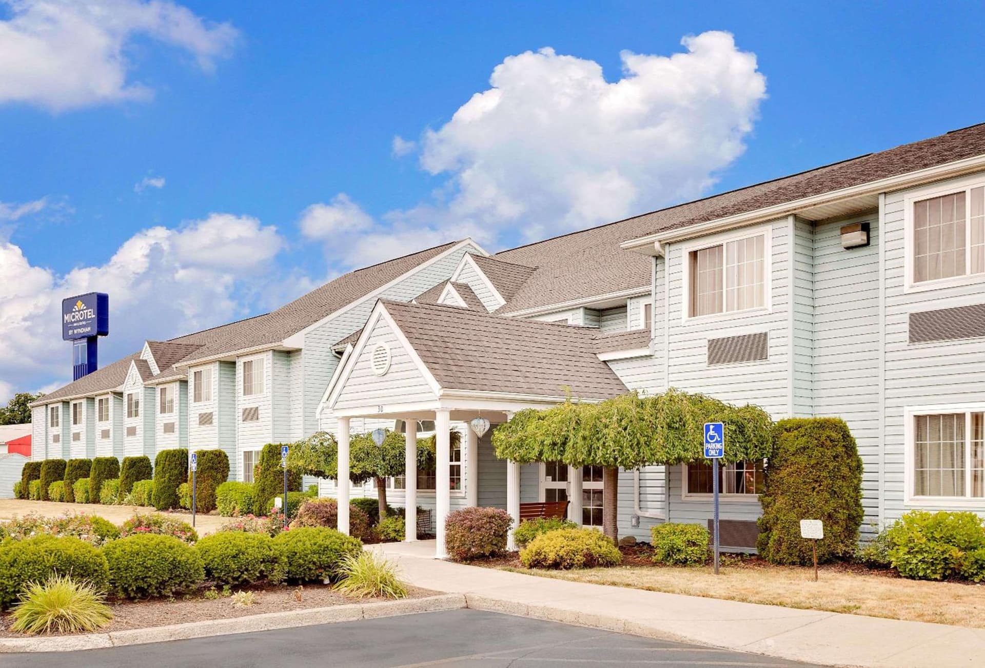 Microtel Inn & Suites by Wyndham Wellsville featured exterior or lobby in Wellsville, NY — similar hotel