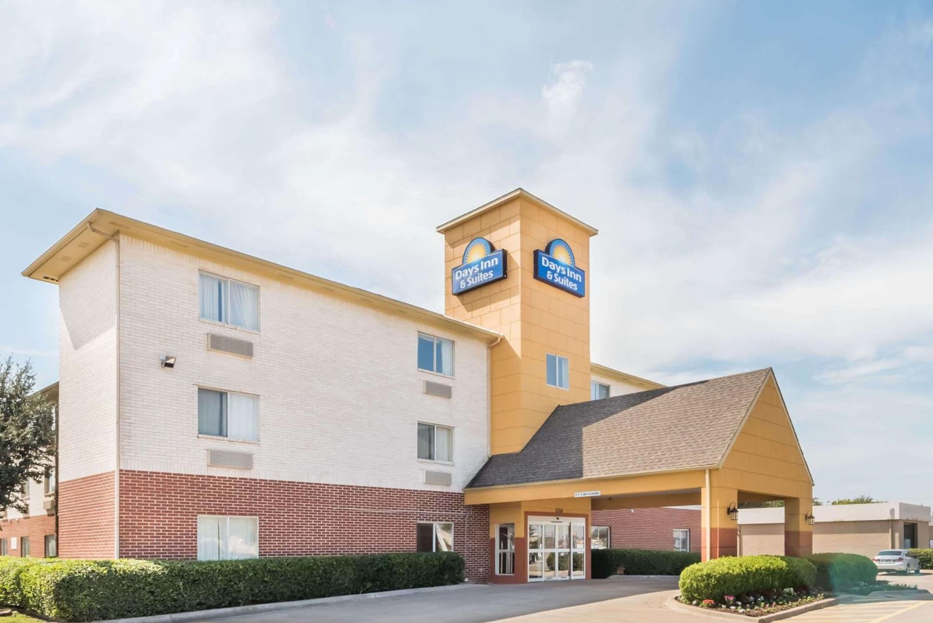 Days Inn & Suites by Wyndham Dallas featured exterior or lobby in Dallas, TX — similar hotel