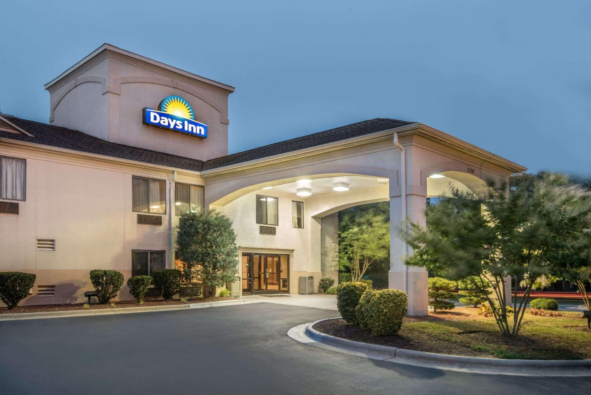 Days Inn by Wyndham Burlington East featured exterior or lobby in Haw River, NC — similar hotel