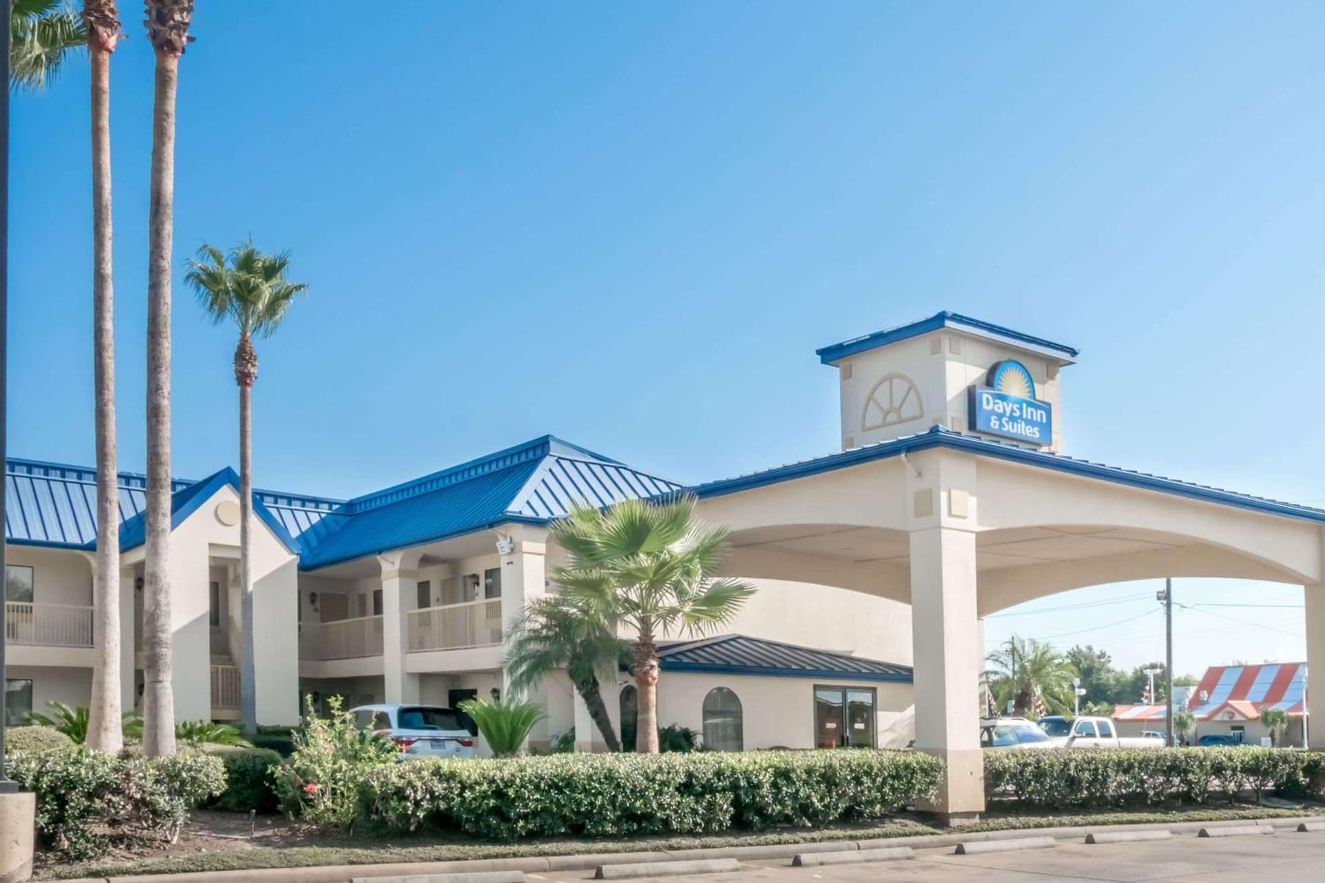 Days Inn & Suites by Wyndham Winnie featured exterior or lobby in Winnie, TX — similar hotel