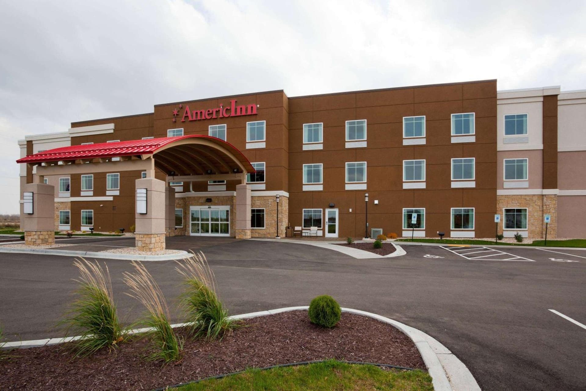 AmericInn by Wyndham Waupun featured exterior or lobby in Waupun, WI — similar hotel