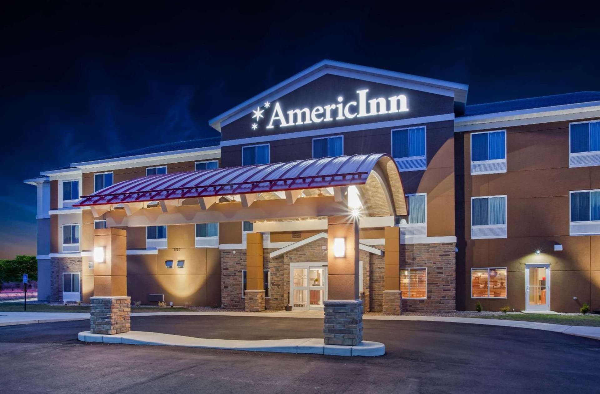 AmericInn by Wyndham DeWitt featured exterior or lobby in De Witt, IA — similar hotel