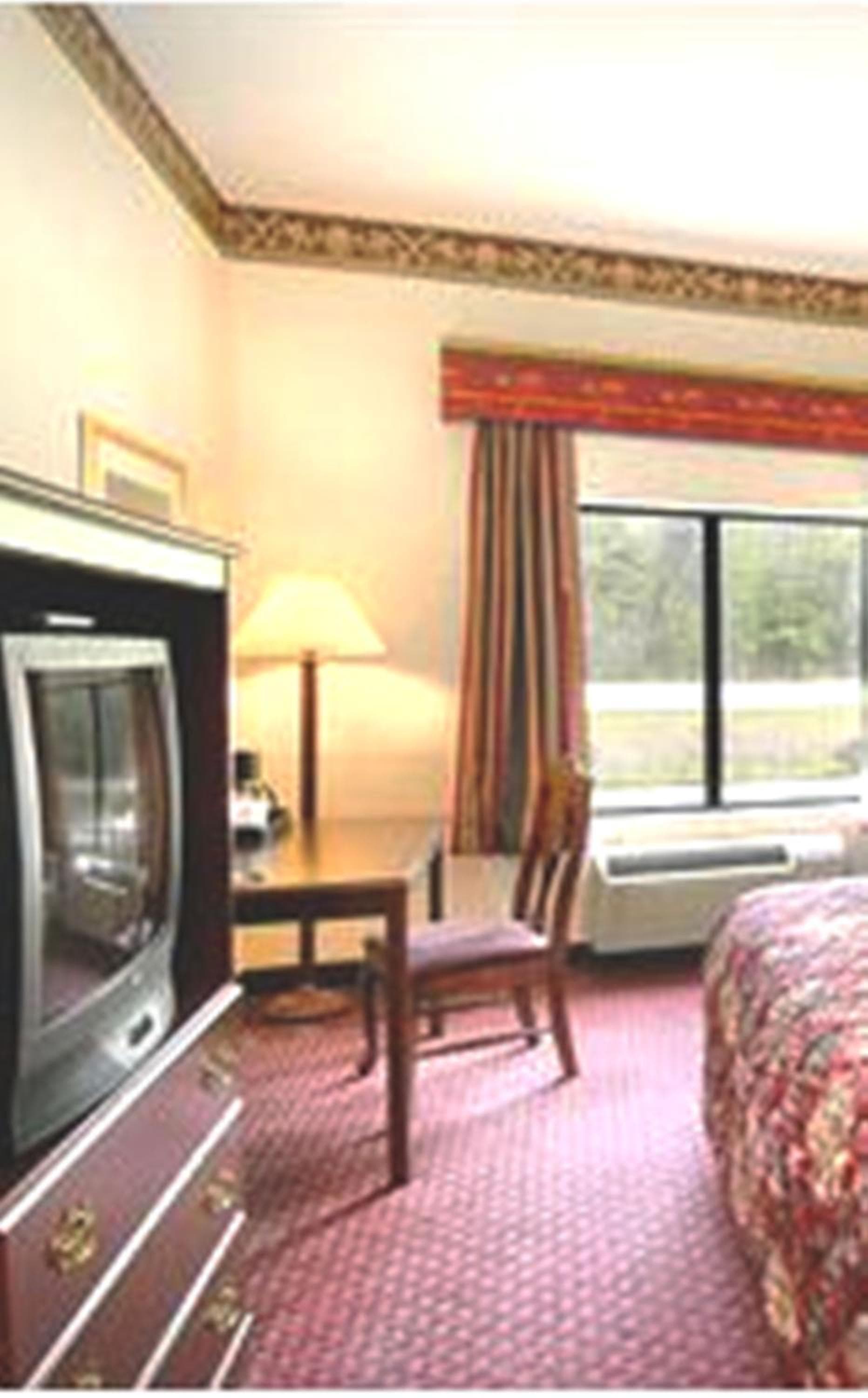Jesup Inn & Suites featured exterior or lobby in Jesup, GA — similar hotel