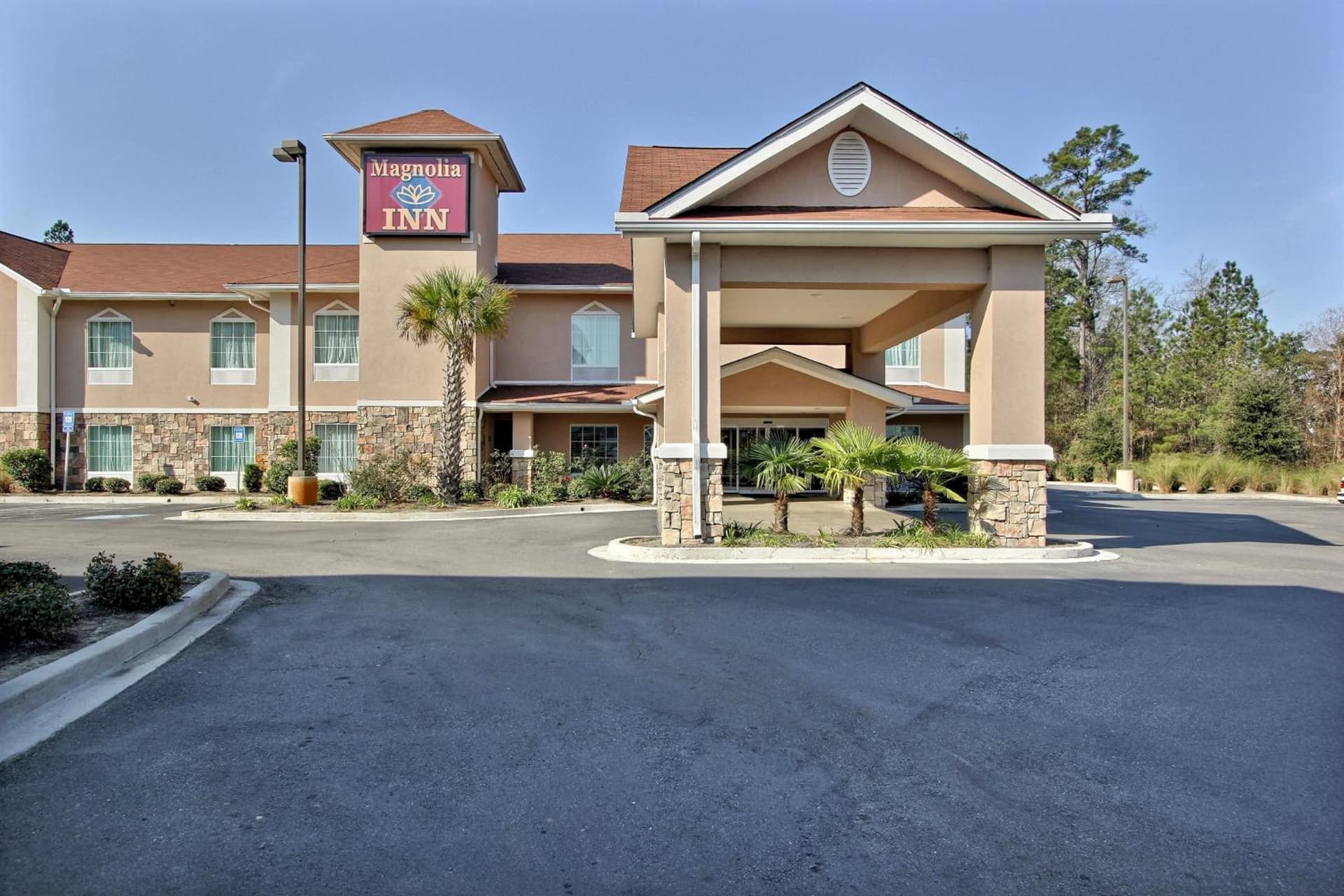 Magnolia Inn and Suites Pooler featured exterior or lobby in Savannah, GA — similar hotel