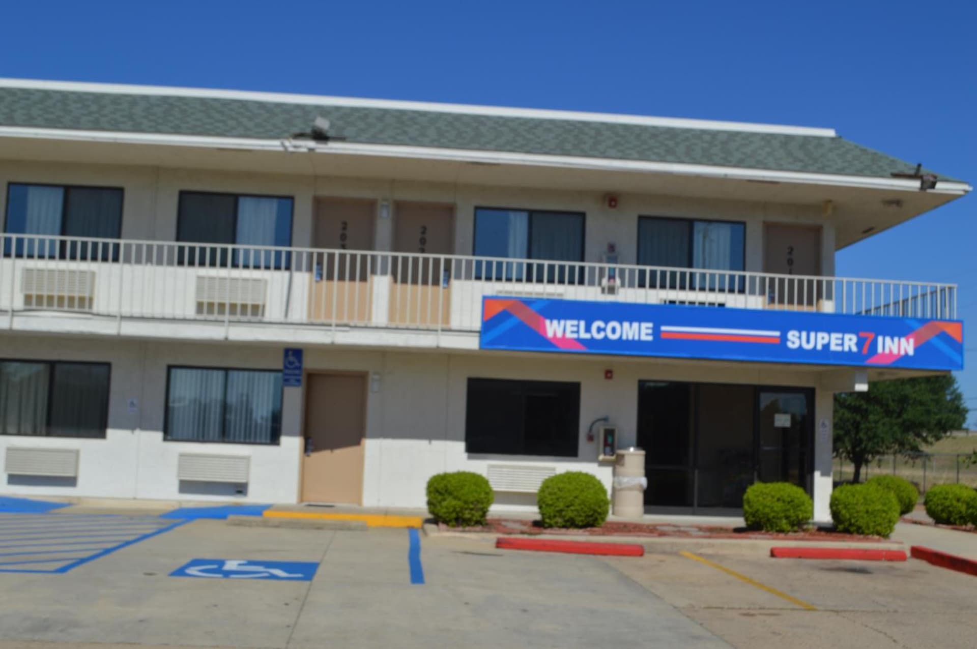 Super 7 Inn featured exterior or lobby in Bossier City, LA — similar hotel