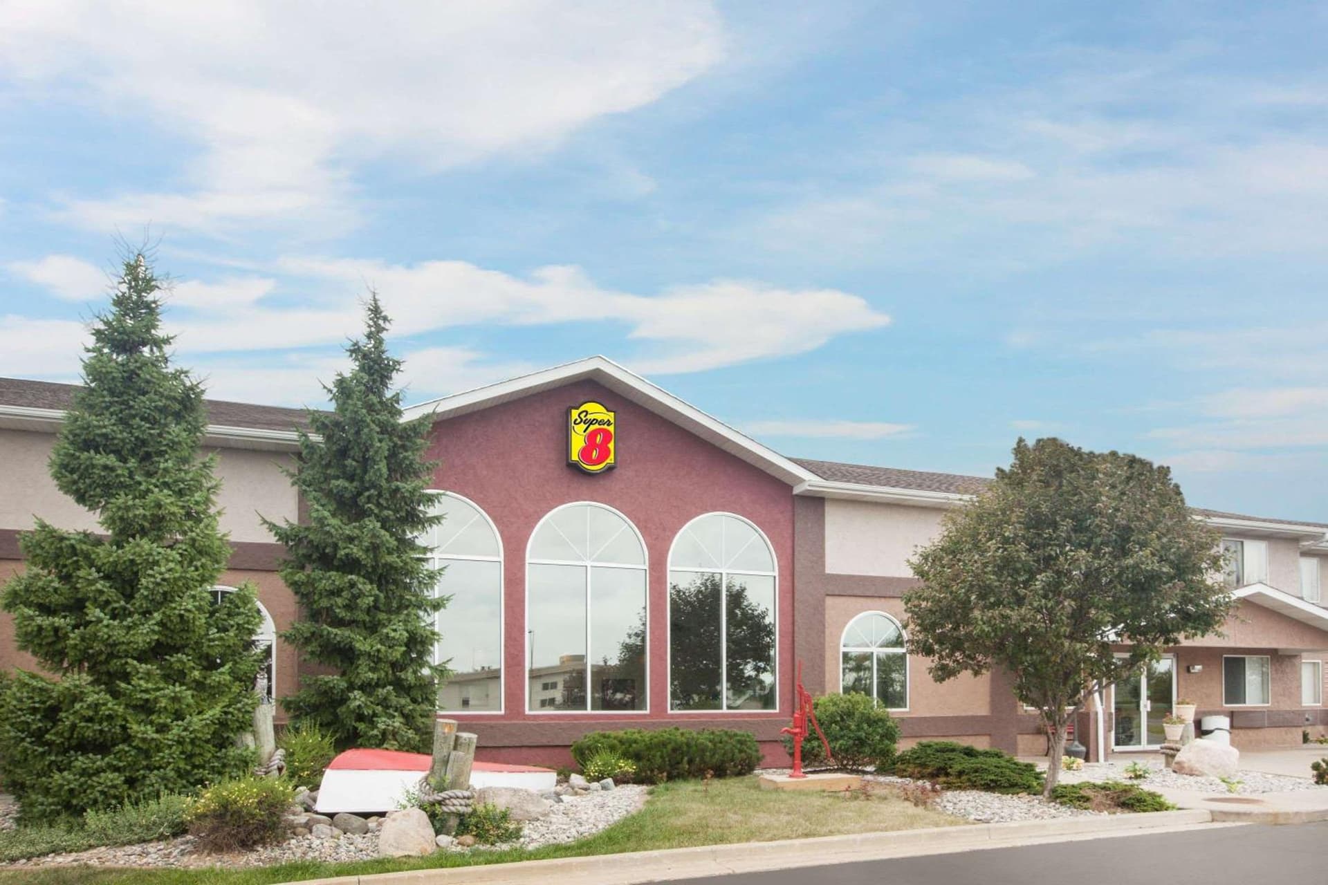 Super 8 by Wyndham West Branch featured exterior or lobby in West Branch, MI — similar hotel