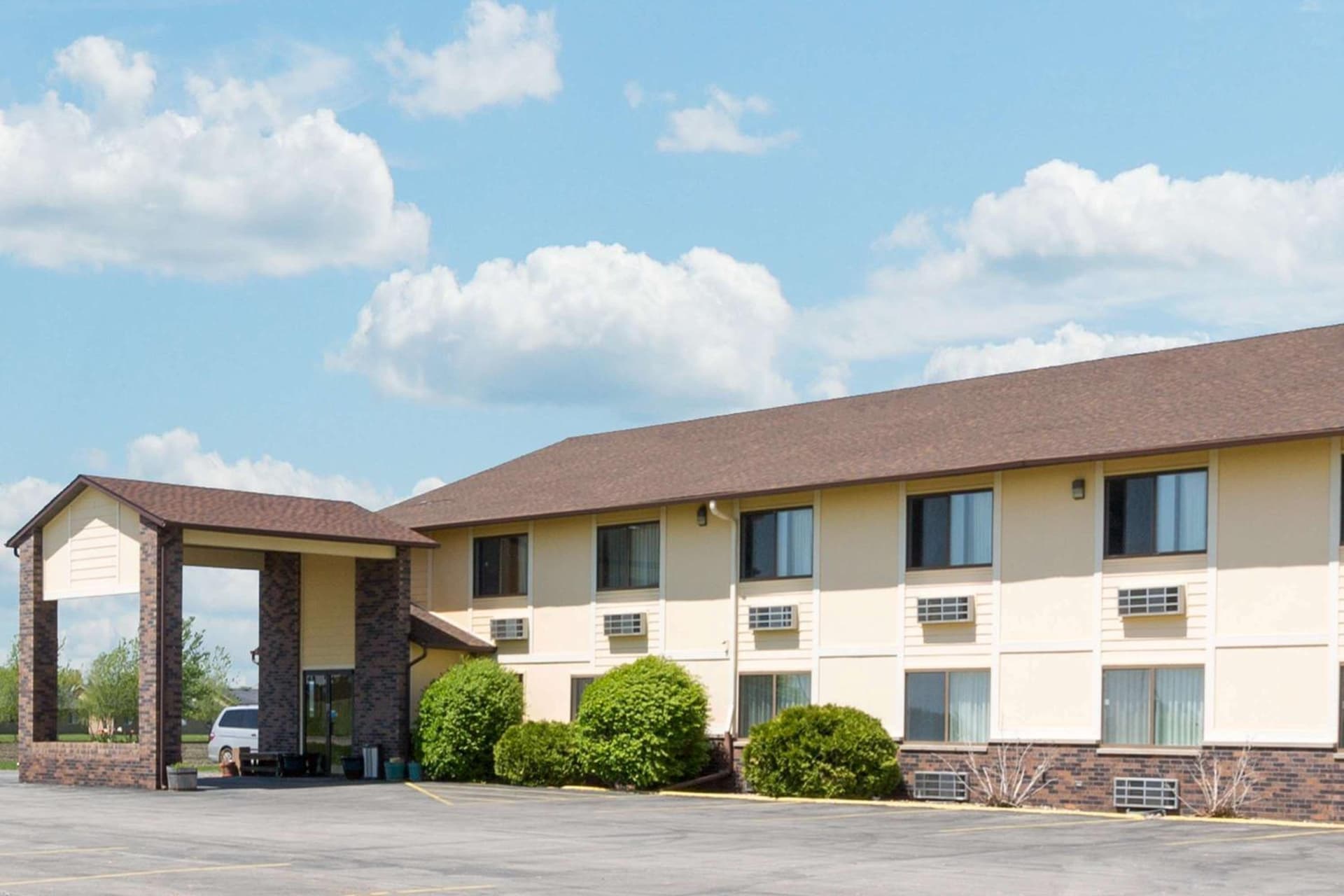 Super 8 by Wyndham Perry IA featured exterior or lobby in Perry, IA — similar hotel