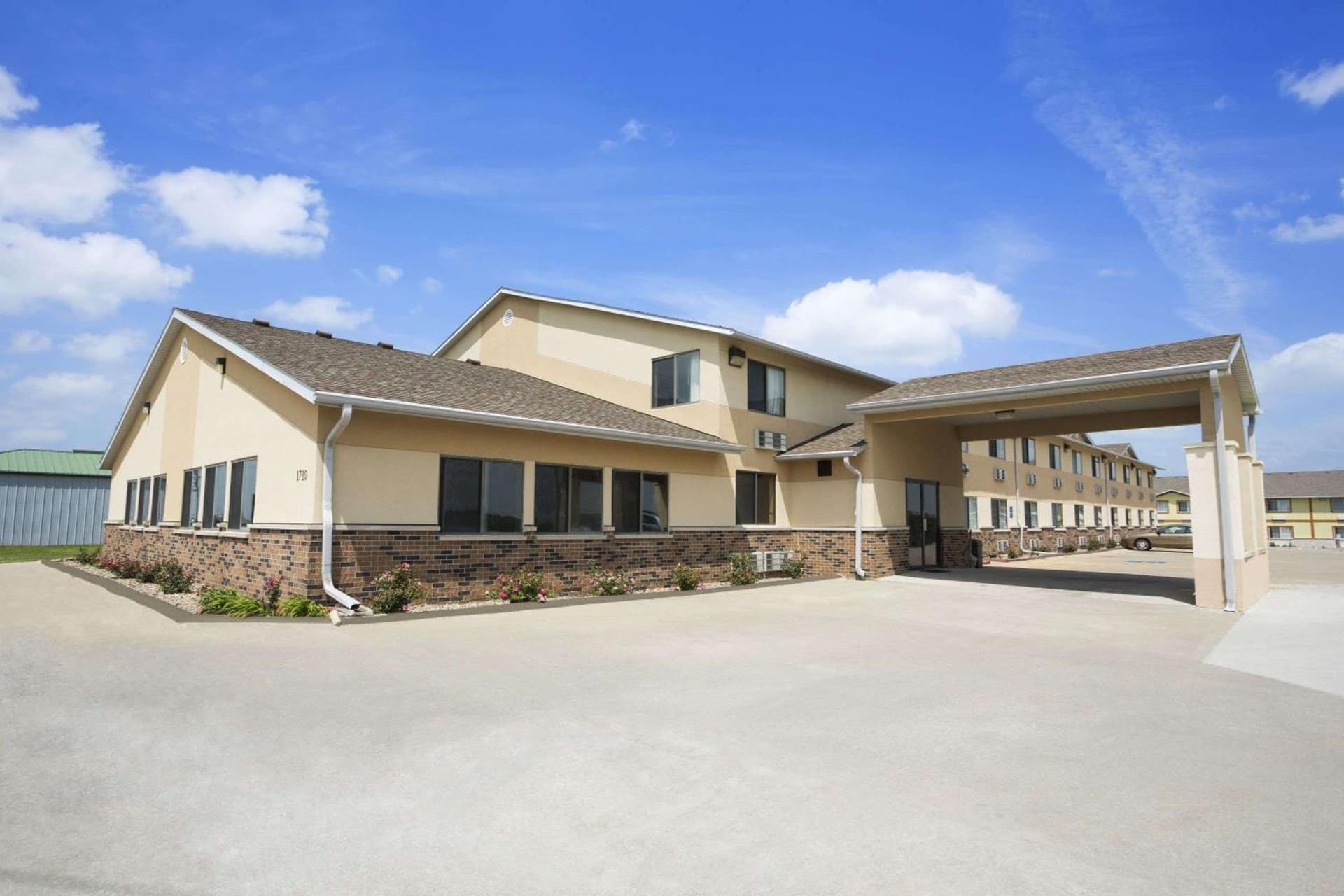 Super 8 by Wyndham Cameron featured exterior or lobby in Cameron, MO — similar hotel