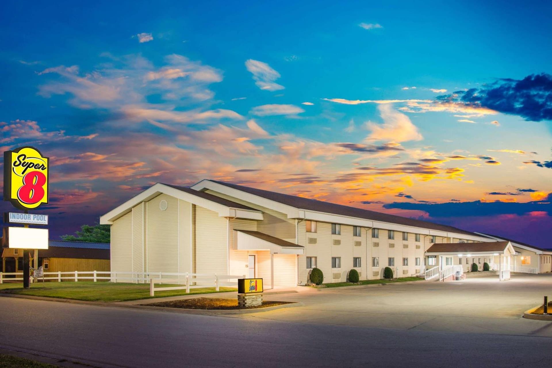Super 8 by Wyndham Nevada featured exterior or lobby in Nevada, MO — similar hotel