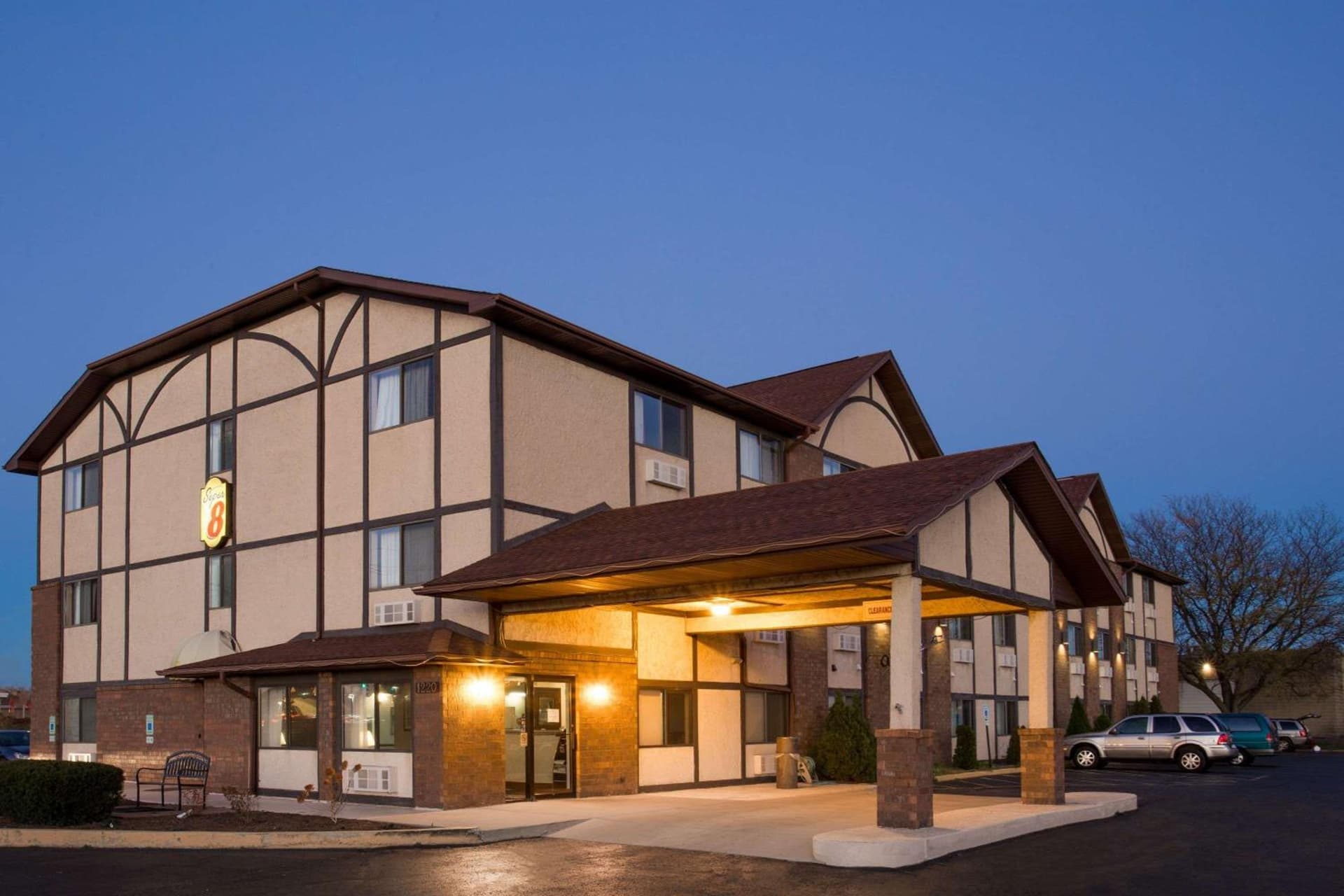 Super 8 by Wyndham Woodstock featured exterior or lobby in Woodstock, IL — similar hotel