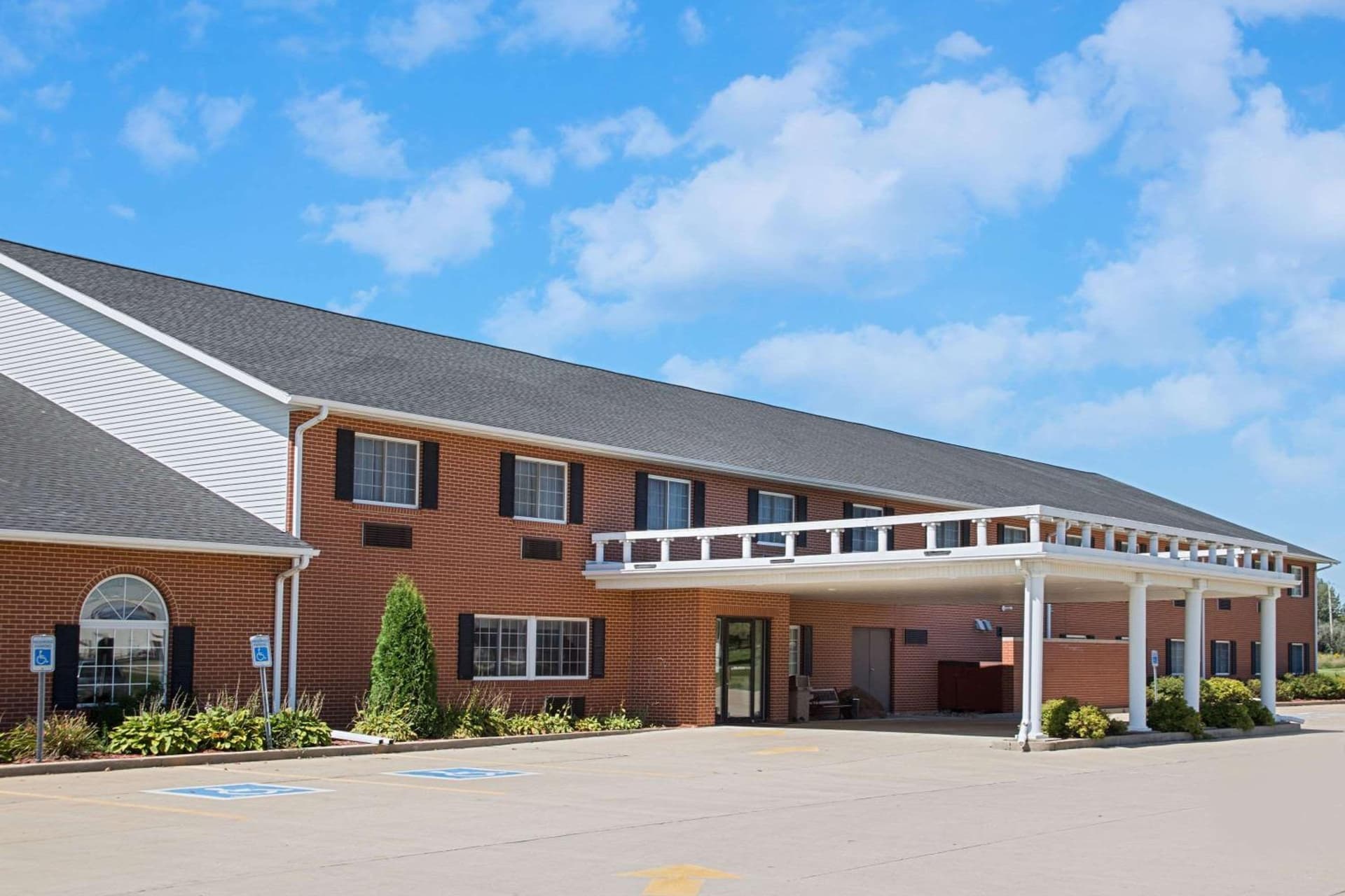 Super 8 by Wyndham New Hampton featured exterior or lobby in New Hampton, IA — similar hotel