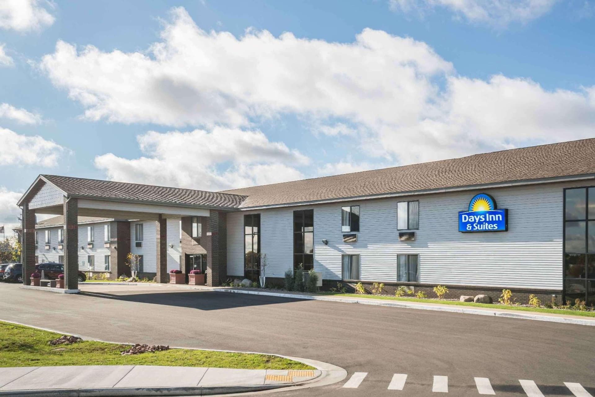 Days Inn & Suites by Wyndham Wausau featured exterior or lobby in Wausau, WI — similar hotel