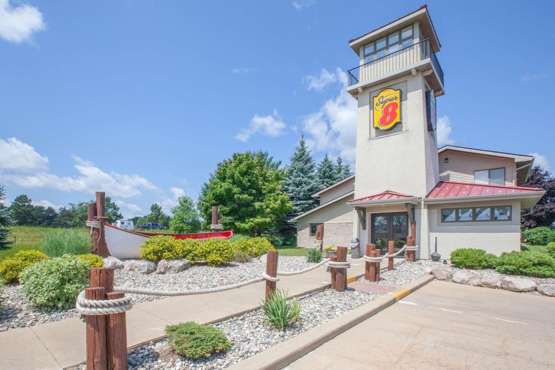 Super 8 by Wyndham Houghton Lake featured exterior or lobby in Houghton Lake, MI — similar hotel