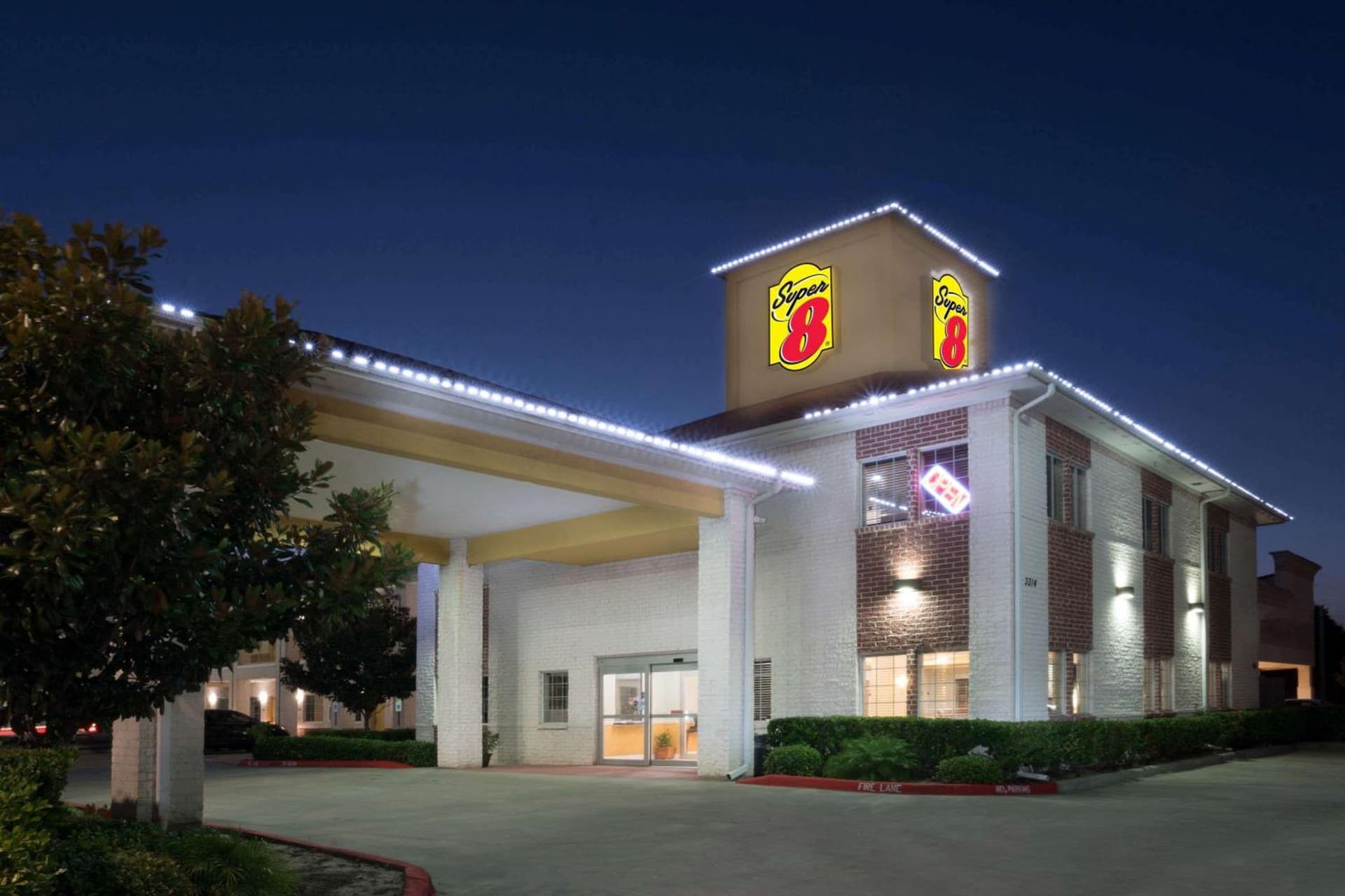 Super 8 by Wyndham Rosenberg TX featured exterior or lobby in Rosenberg, TX — similar hotel