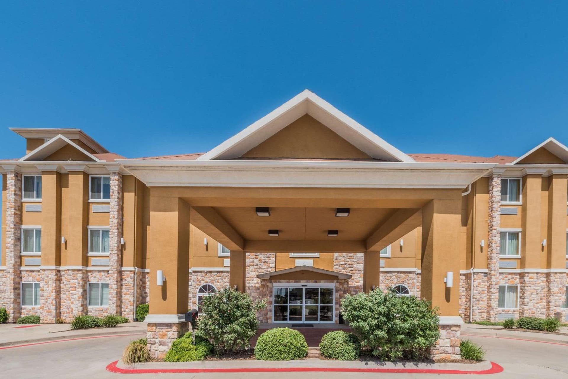 Days Inn & Suites by Wyndham Cleburne TX featured exterior or lobby in Cleburne, TX — similar hotel