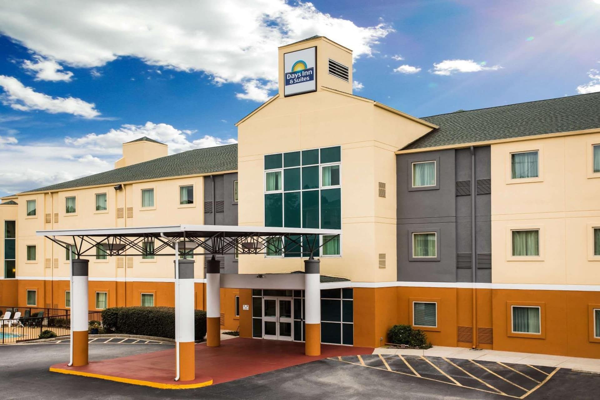 Days Inn & Suites by Wyndham Augusta Near Fort Eisenhower featured exterior or lobby in Augusta, GA — similar hotel