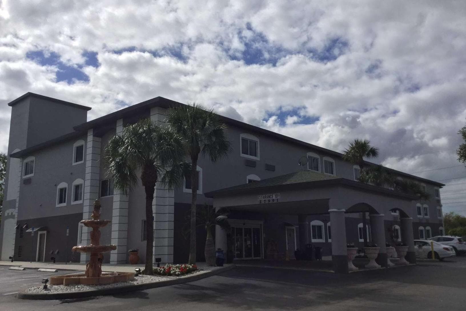 Days Inn & Suites by Wyndham Bonita Springs North Naples exterior or lobby in Bonita Springs, FL — main listing photo