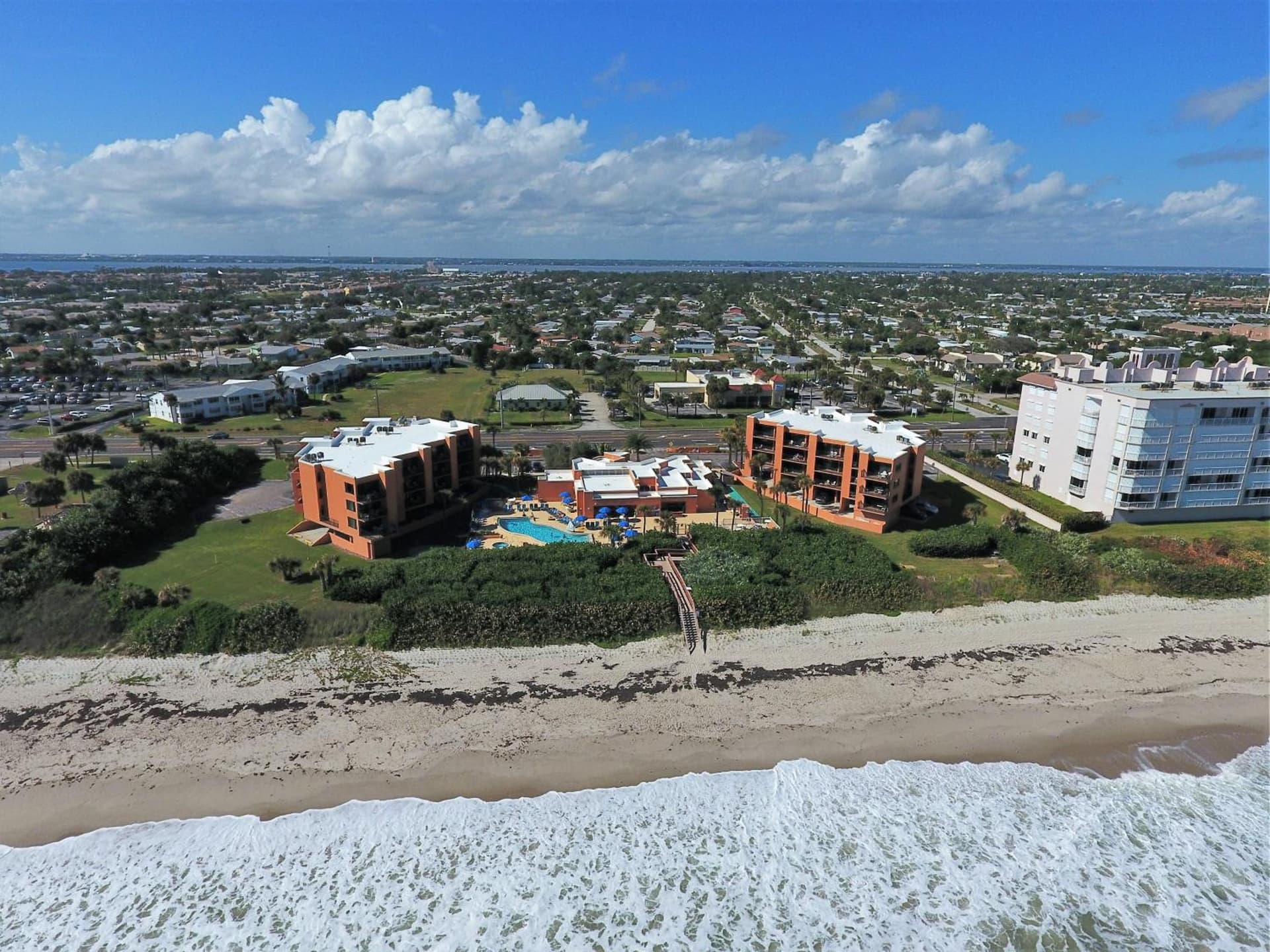 Oceanique Resort featured exterior or lobby in Indian Harbour Beach, FL — similar hotel