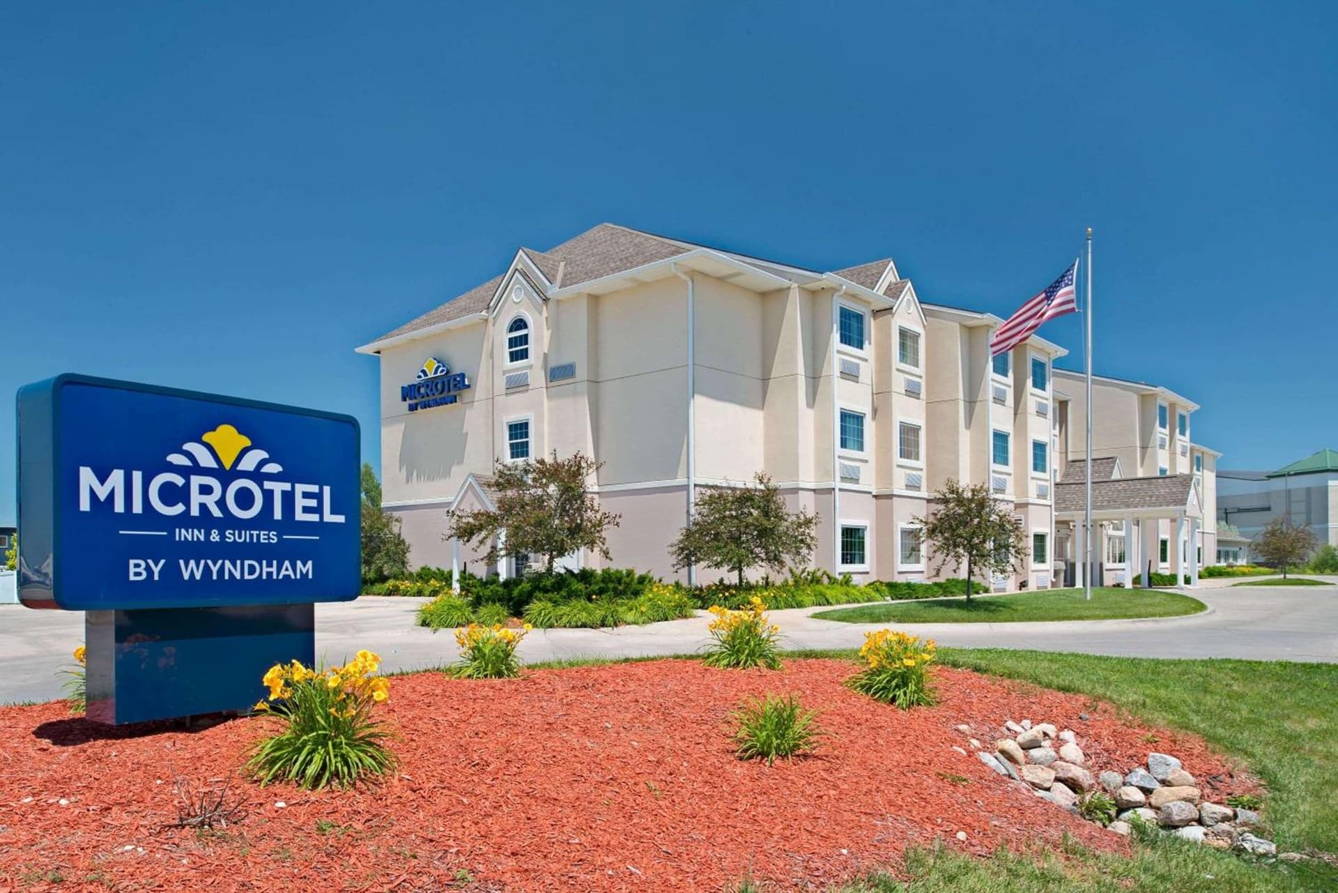 Microtel Inn & Suites by Wyndham Bluffs featured exterior or lobby in Council Bluffs, IA — similar hotel