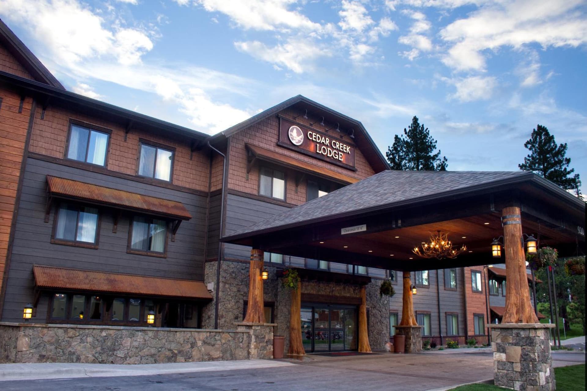 Cedar Creek Lodge & Conference Center featured exterior or lobby in Columbia Falls, MT — similar hotel
