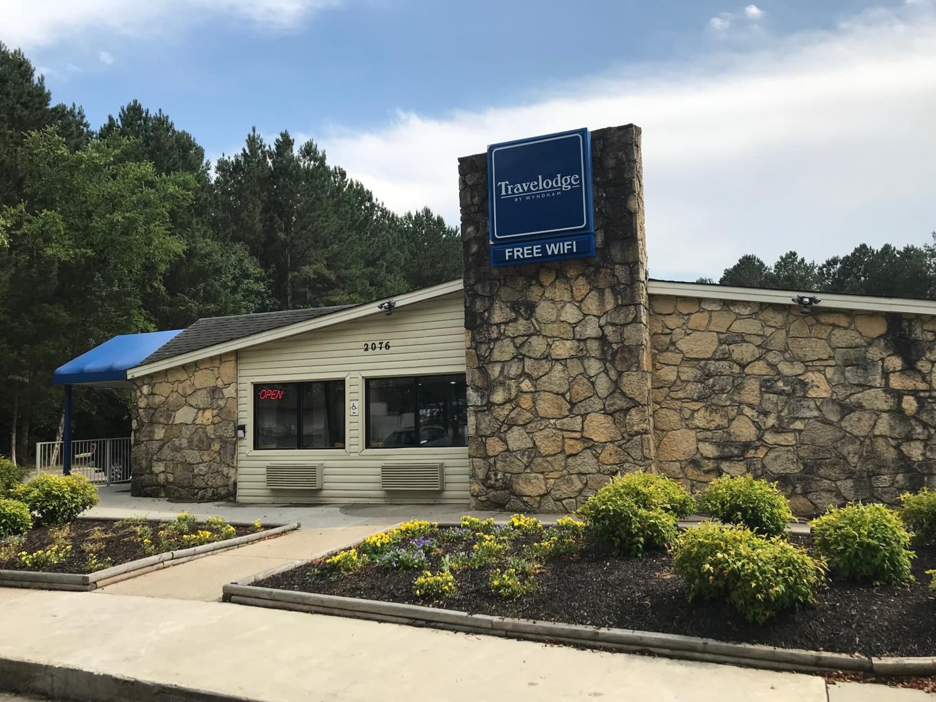 Travelodge by Wyndham Fayetteville featured exterior or lobby in Fayetteville, NC — similar hotel