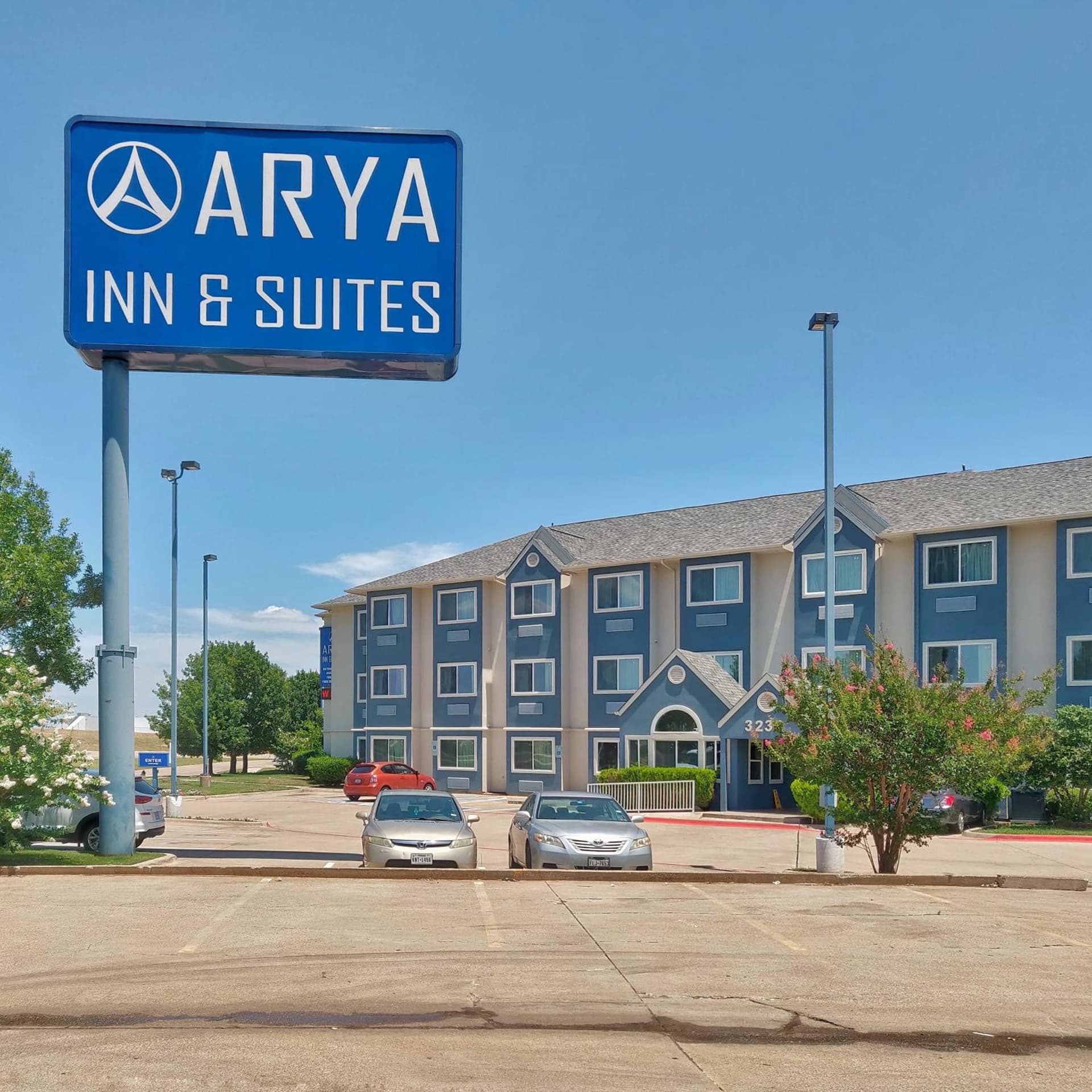 Arya Inn and Suites featured exterior or lobby in Irving, TX — similar hotel