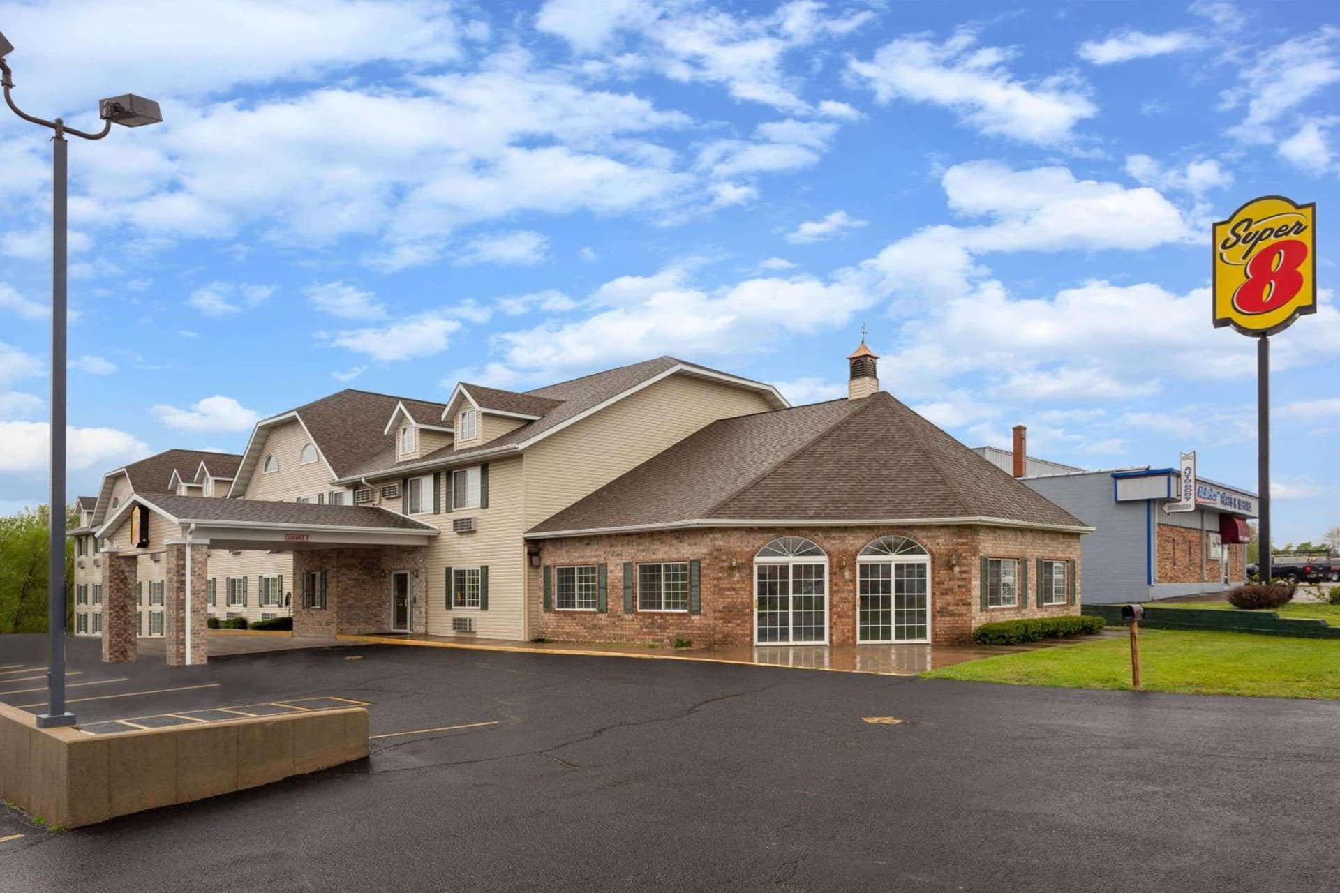 Super 8 by Wyndham Reedsburg featured exterior or lobby in Reedsburg, WI — similar hotel