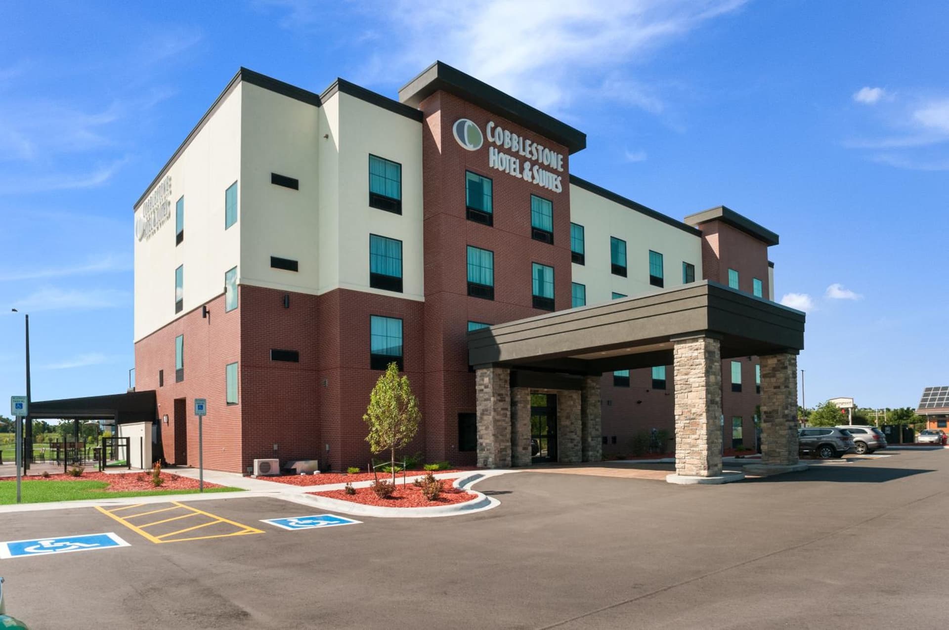 Cobblestone Hotel & Suites Appleton International Airport featured exterior or lobby in Neenah, WI — similar hotel
