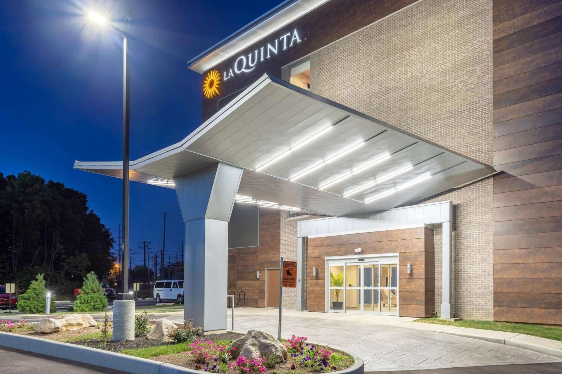 La Quinta Inn and Suites by Wyndham Bloomington featured exterior or lobby in Bloomington, IN — similar hotel