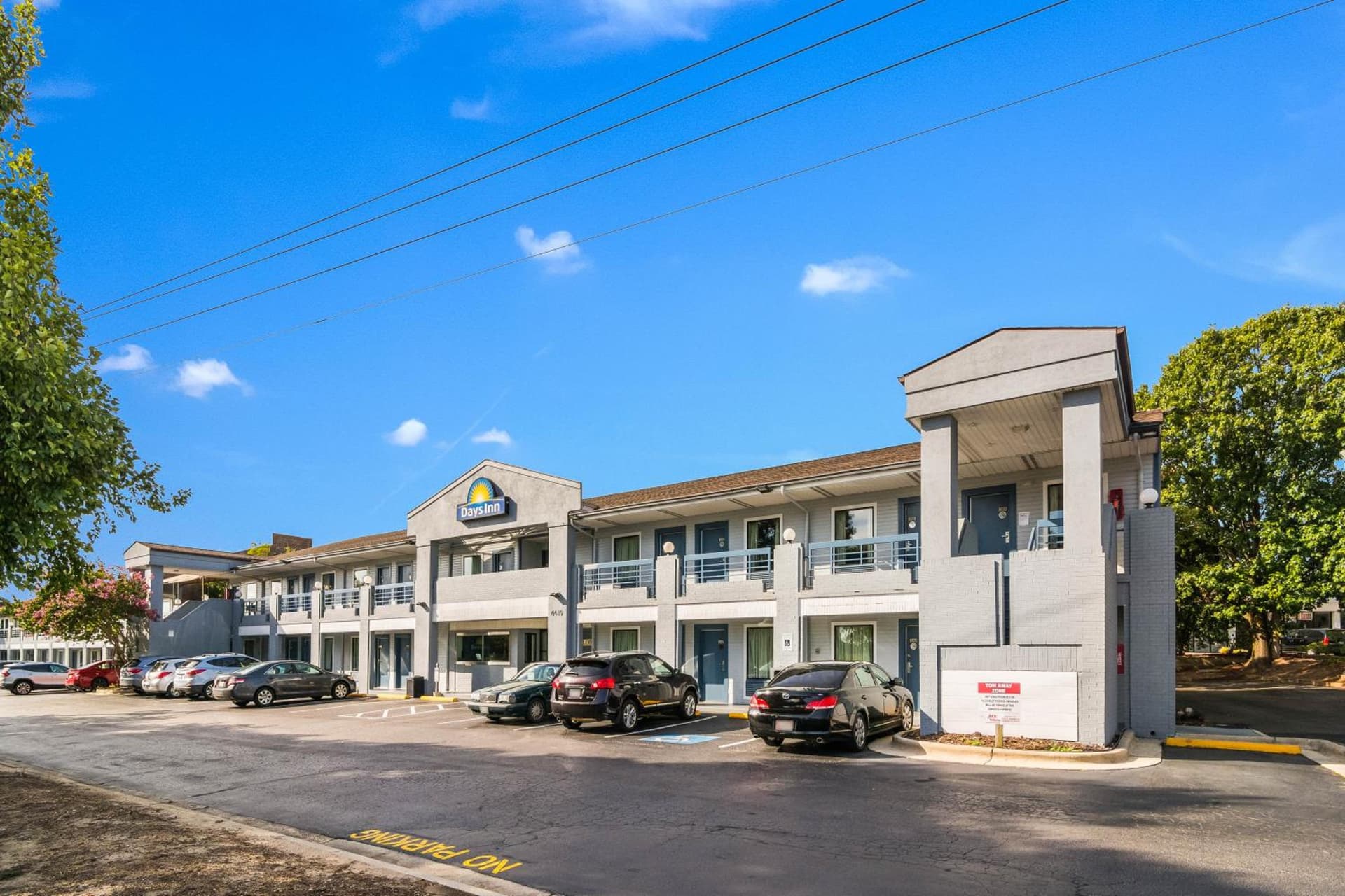 Days Inn by Wyndham Raleigh Glenwood-Crabtree exterior or lobby in Raleigh, NC — main listing photo