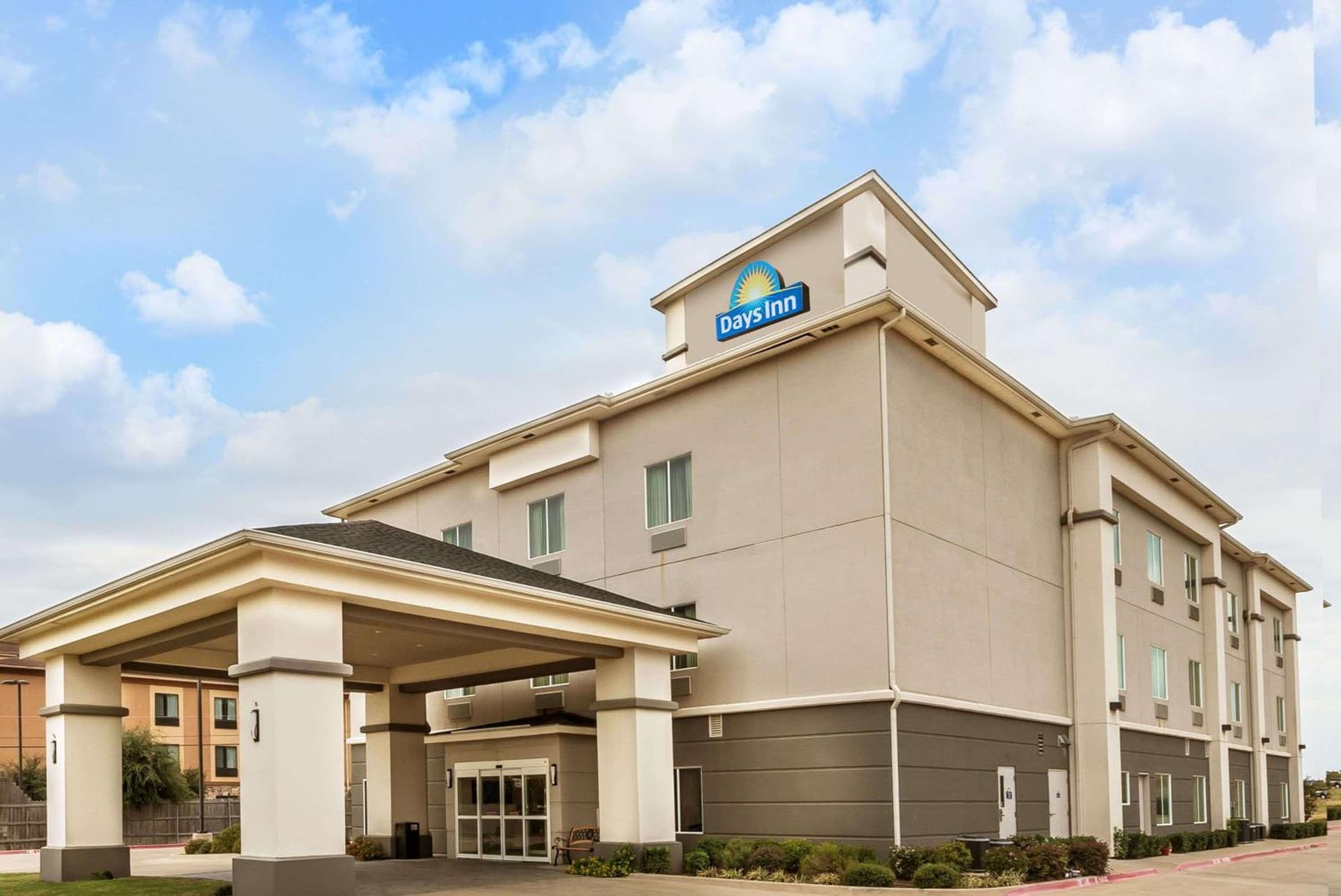 Days Inn & Suites by Wyndham Mineral Wells featured exterior or lobby in Mineral Wells, TX — similar hotel