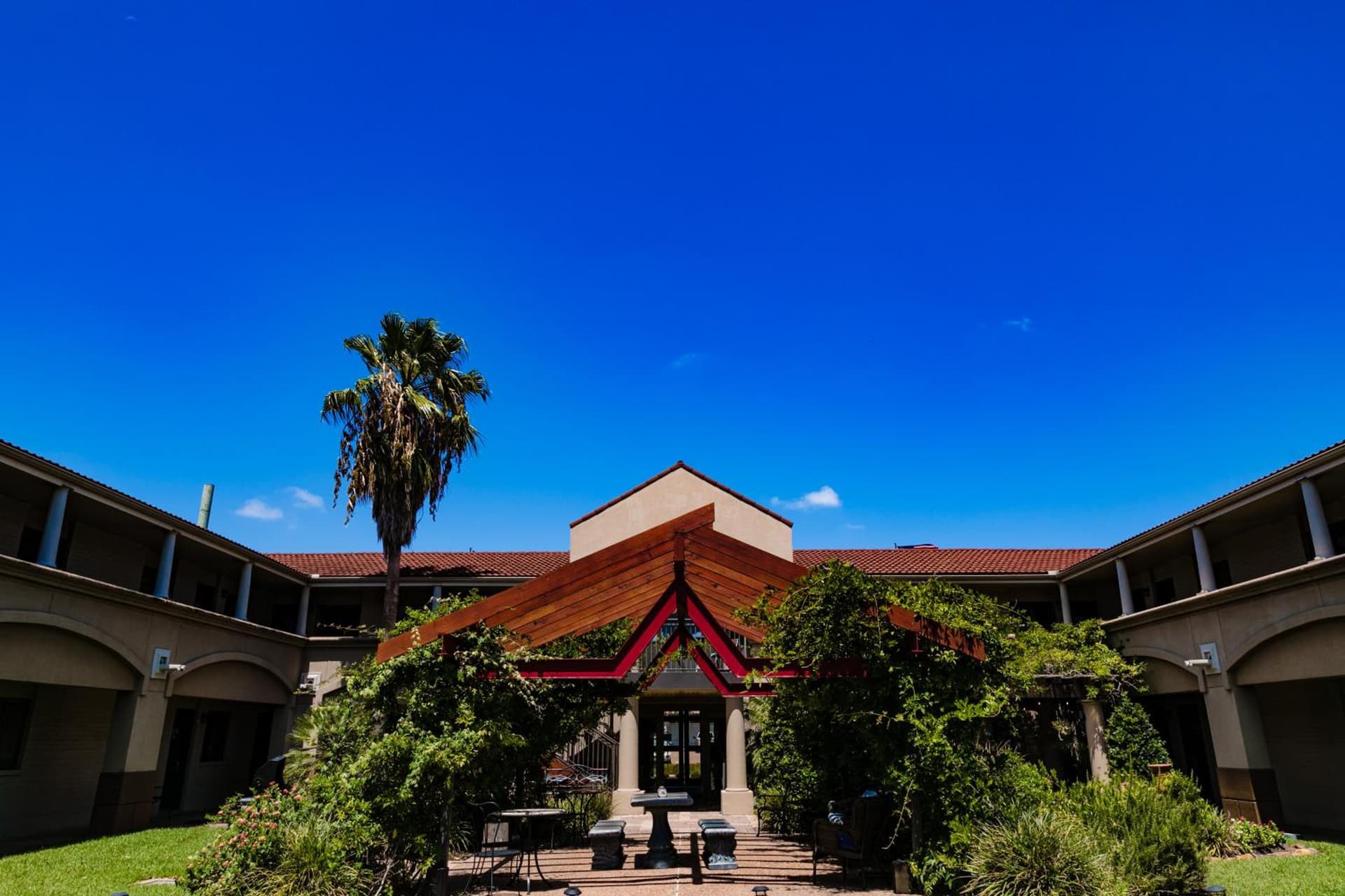 Vineyard Court Designer Suites Hotel exterior or lobby in College Station, TX — main listing photo