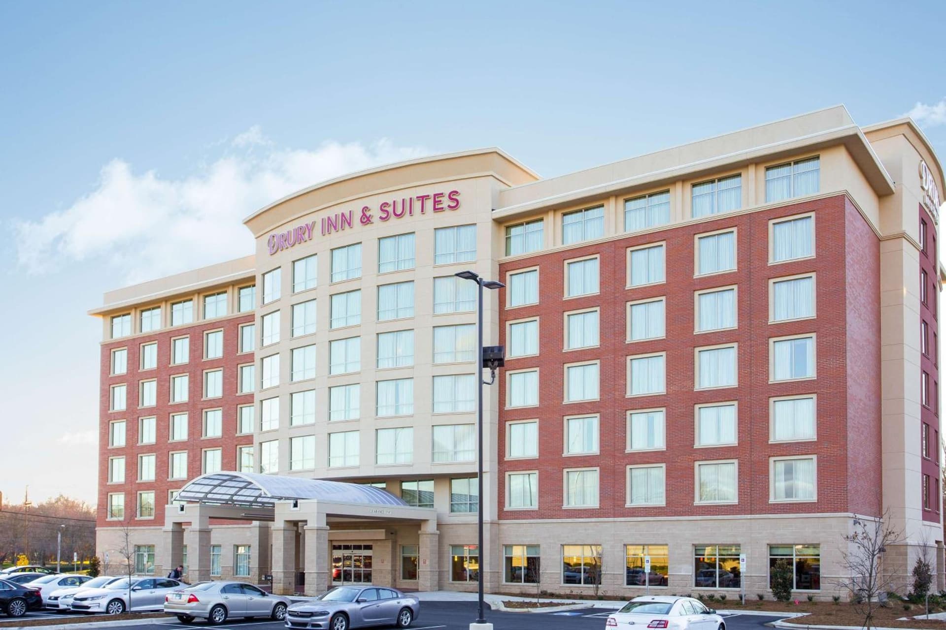 Drury Inn & Suites Charlotte Arrowood featured exterior or lobby in Charlotte, NC — similar hotel