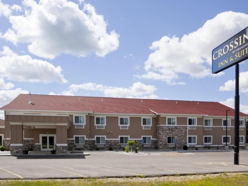 American Inn & Suites featured exterior or lobby in Parkers Prairie, MN — similar hotel