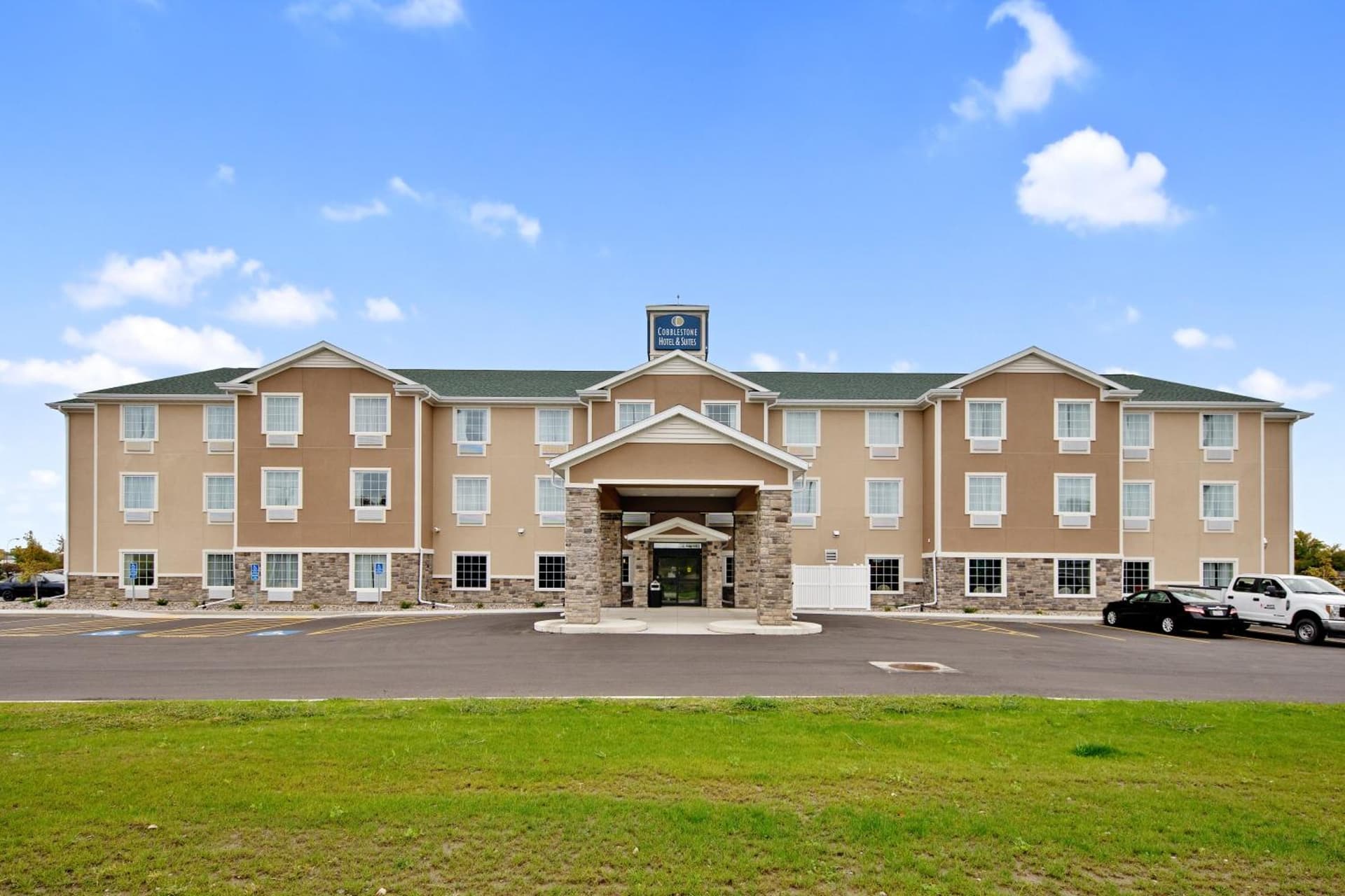 Cobblestone Hotel & Suites - Austin featured exterior or lobby in Austin, MN — similar hotel