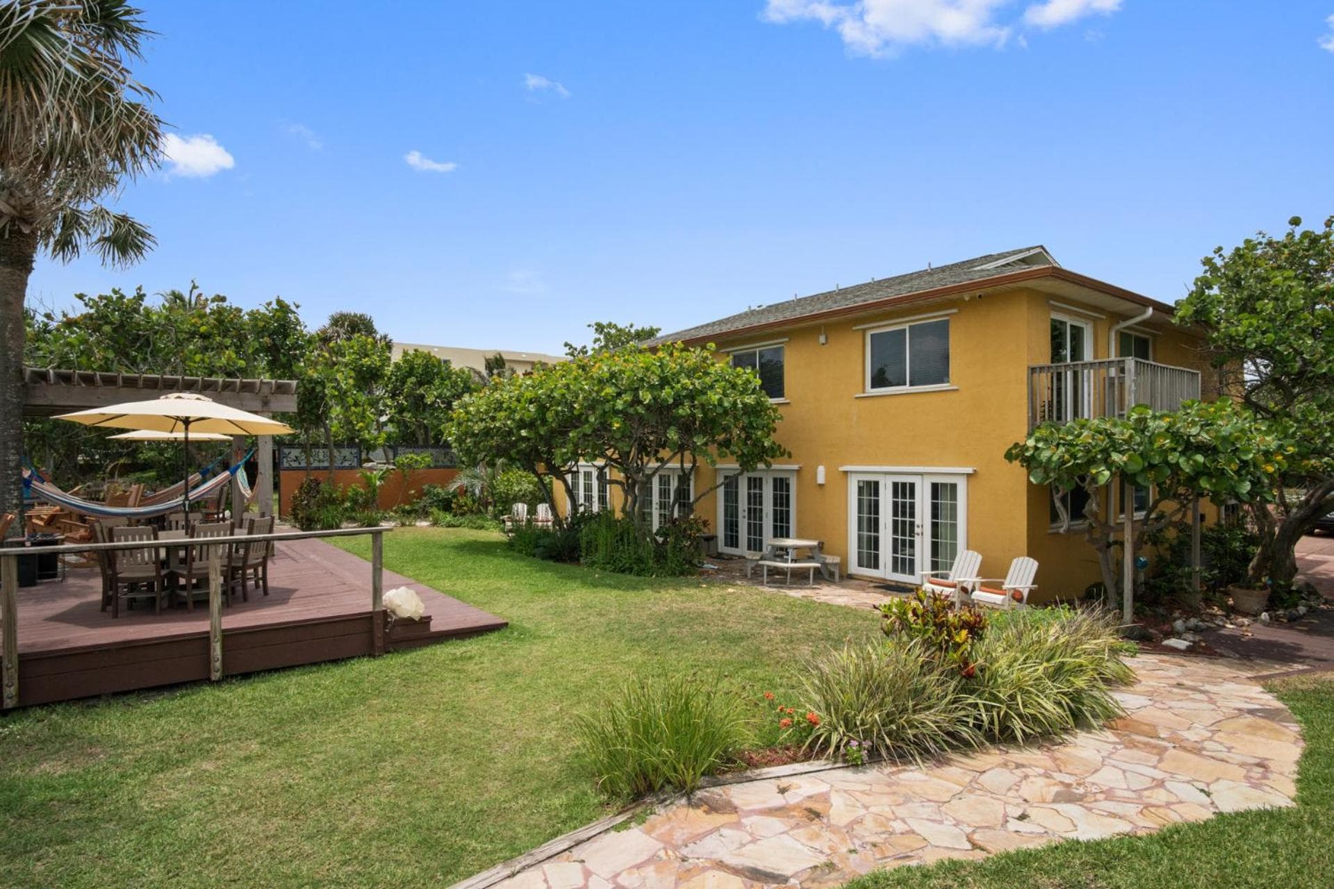 Beach Place Guesthouses featured exterior or lobby in Cocoa Beach, FL — similar hotel