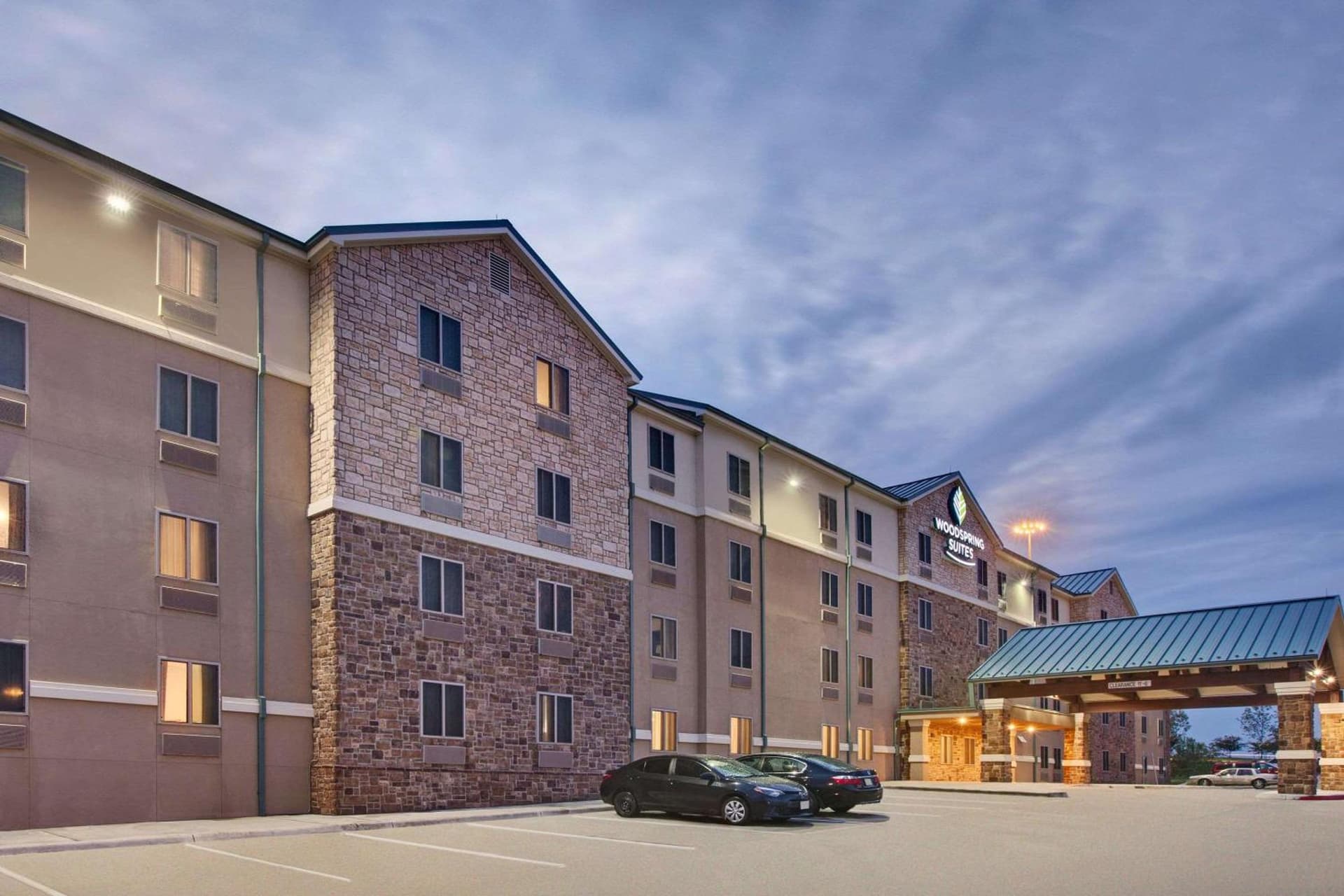 WoodSpring Suites Las Colinas - Northwest Dallas featured exterior or lobby in Irving, TX — similar hotel