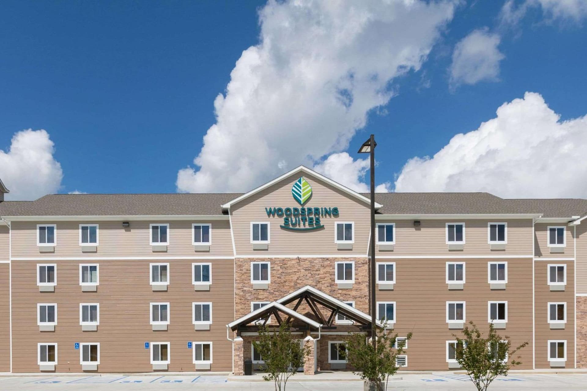 WoodSpring Suites Lafayette featured exterior or lobby in Lafayette, LA — similar hotel