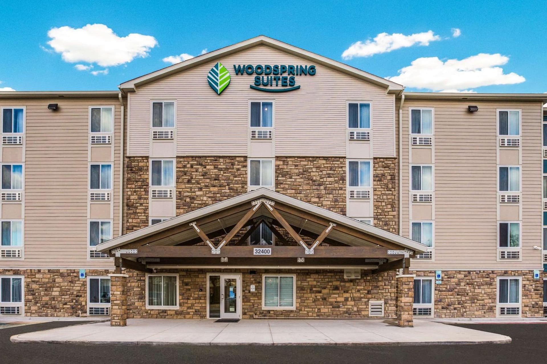 WoodSpring Suites Detroit Madison Heights featured exterior or lobby in Madison Heights, MI — similar hotel