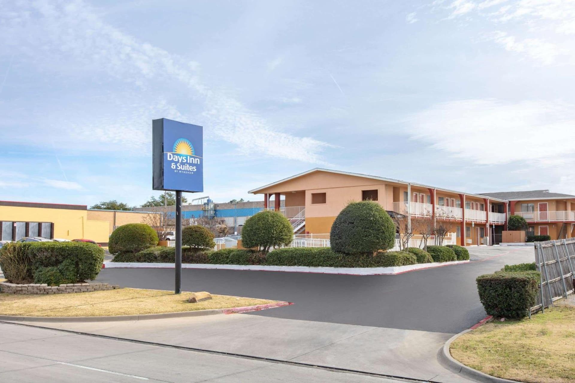 Days Inn & Suites by Wyndham Arlington Near Six Flags featured exterior or lobby in Arlington, TX — similar hotel