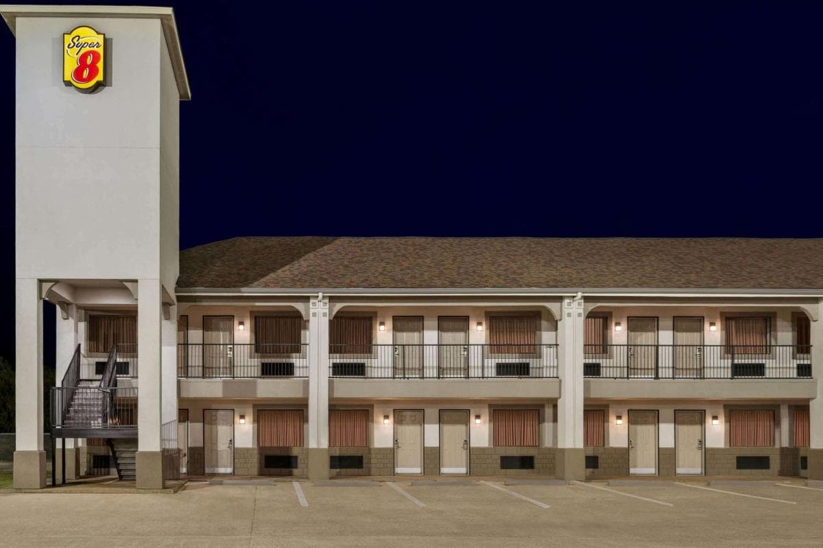 Super 8 by Wyndham Houston/Dtwn/I-610 exterior or lobby in Houston, TX — main listing photo