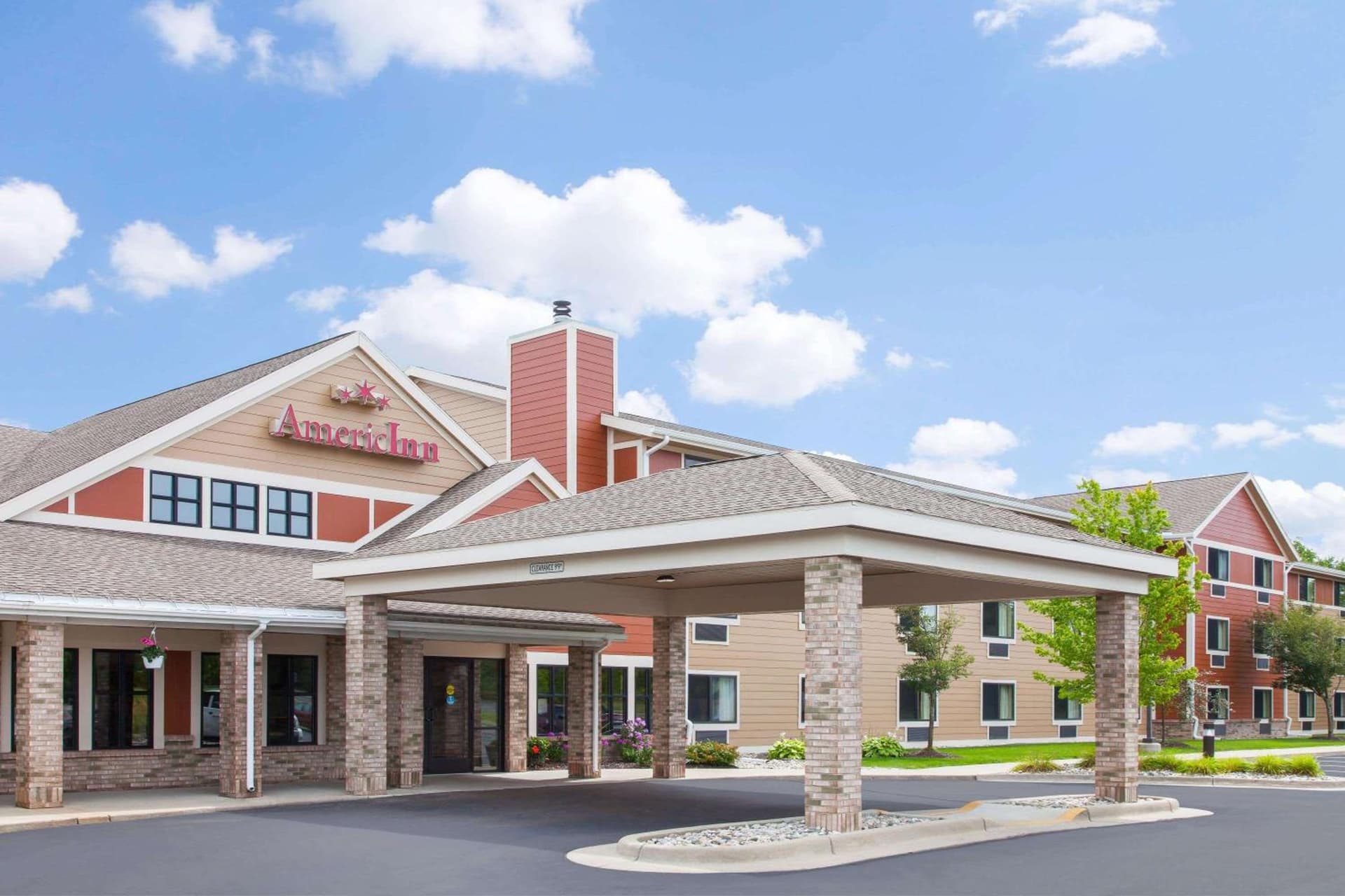 AmericInn by Wyndham Greenville featured exterior or lobby in Greenville, MI — similar hotel