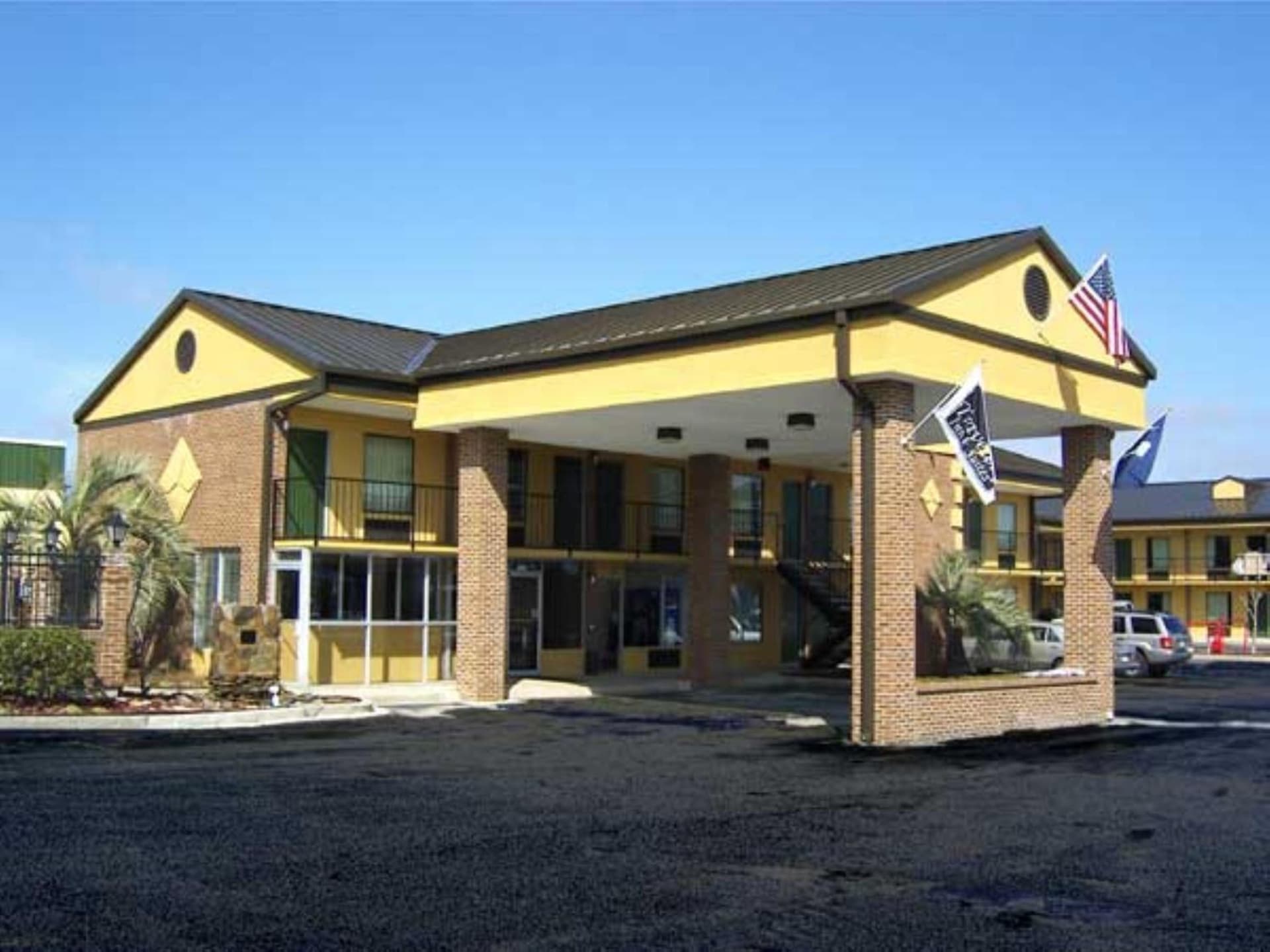 Travelers Inn & Suites featured exterior or lobby in Sumter, SC — similar hotel