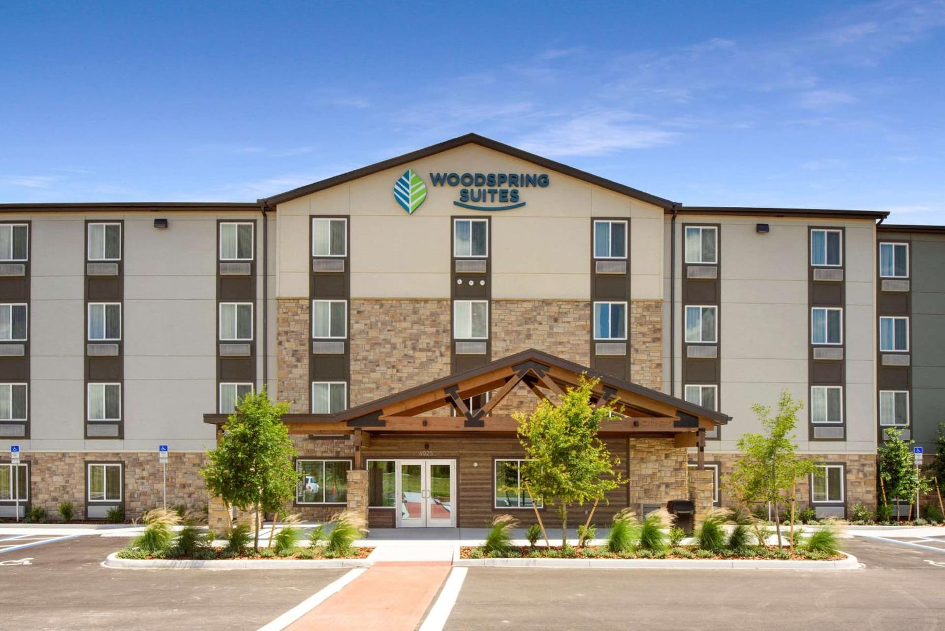 WoodSpring Suites Orlando I-4 & Convention Center featured exterior or lobby in Orlando, FL — similar hotel