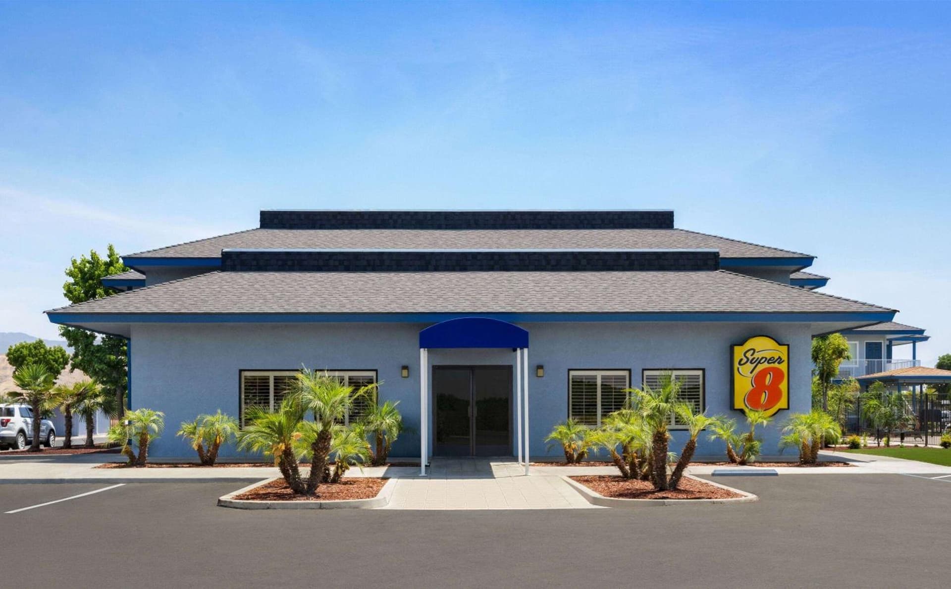 Super 8 by Wyndham Lindsay Olive Tree featured exterior or lobby in Lindsay, CA — similar hotel