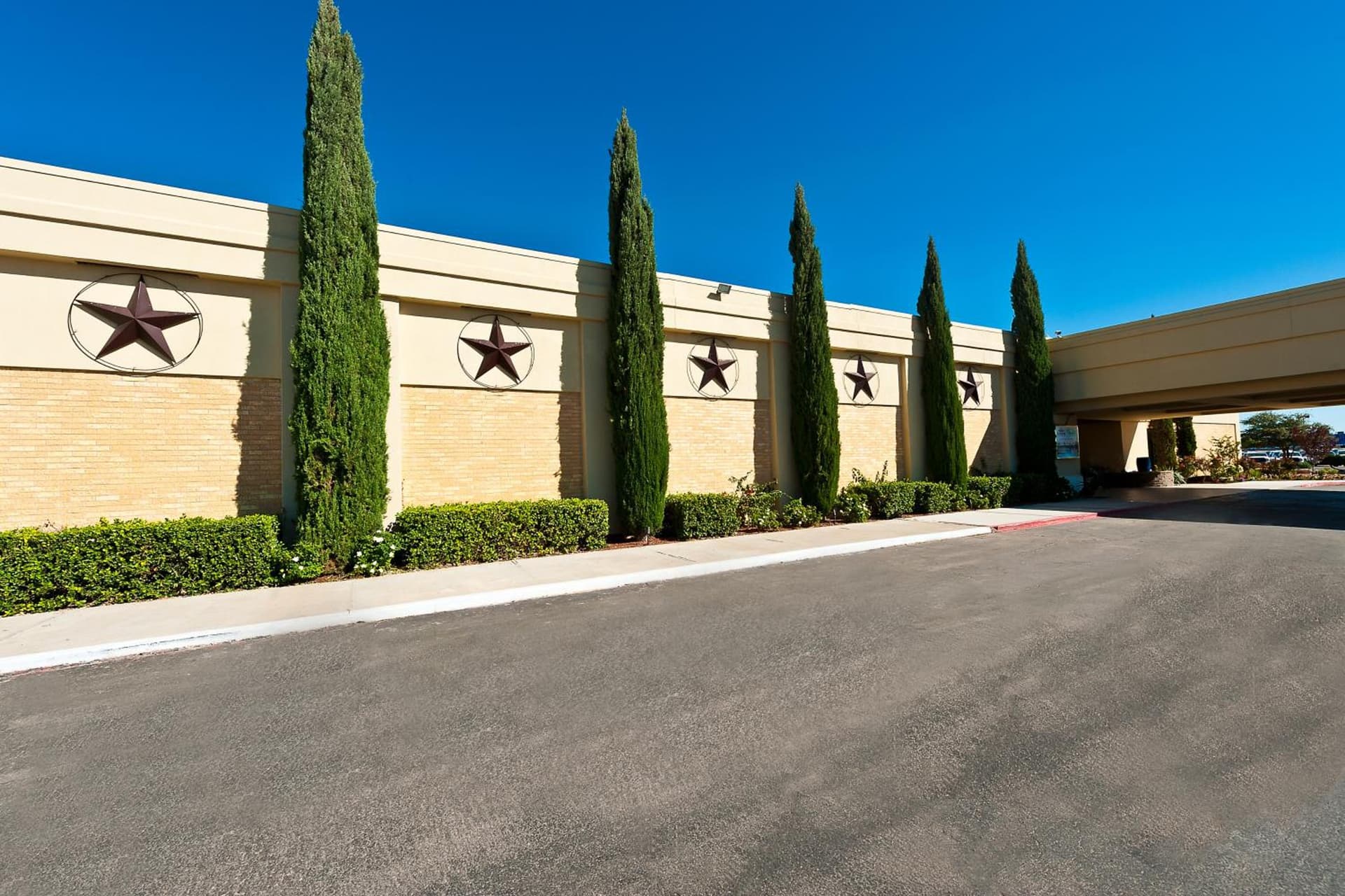 Grand Texan Hotel and Convention Center exterior or lobby in Midland, TX — main listing photo