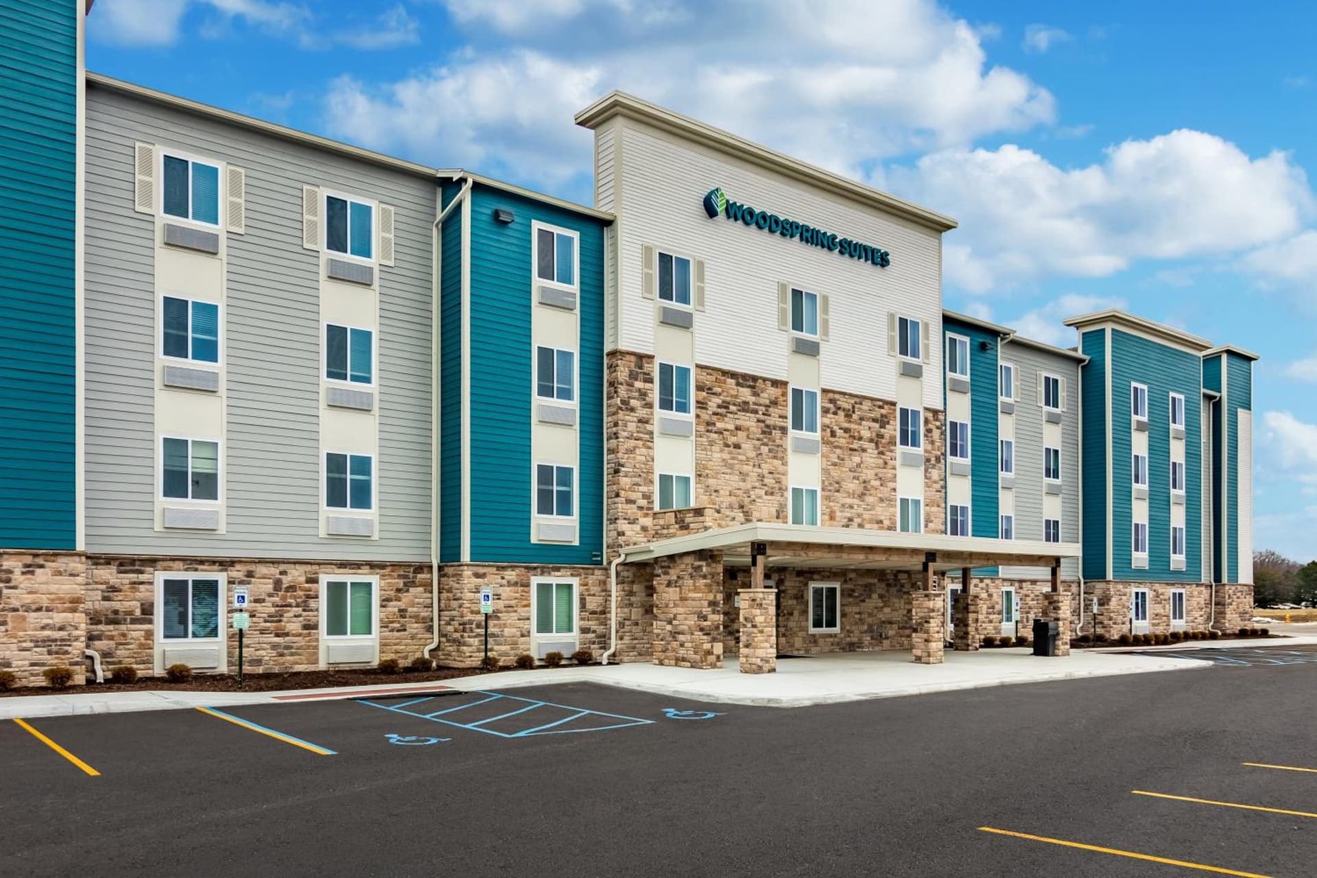 WoodSpring Suites Toledo Maumee featured exterior or lobby in Maumee, OH — similar hotel