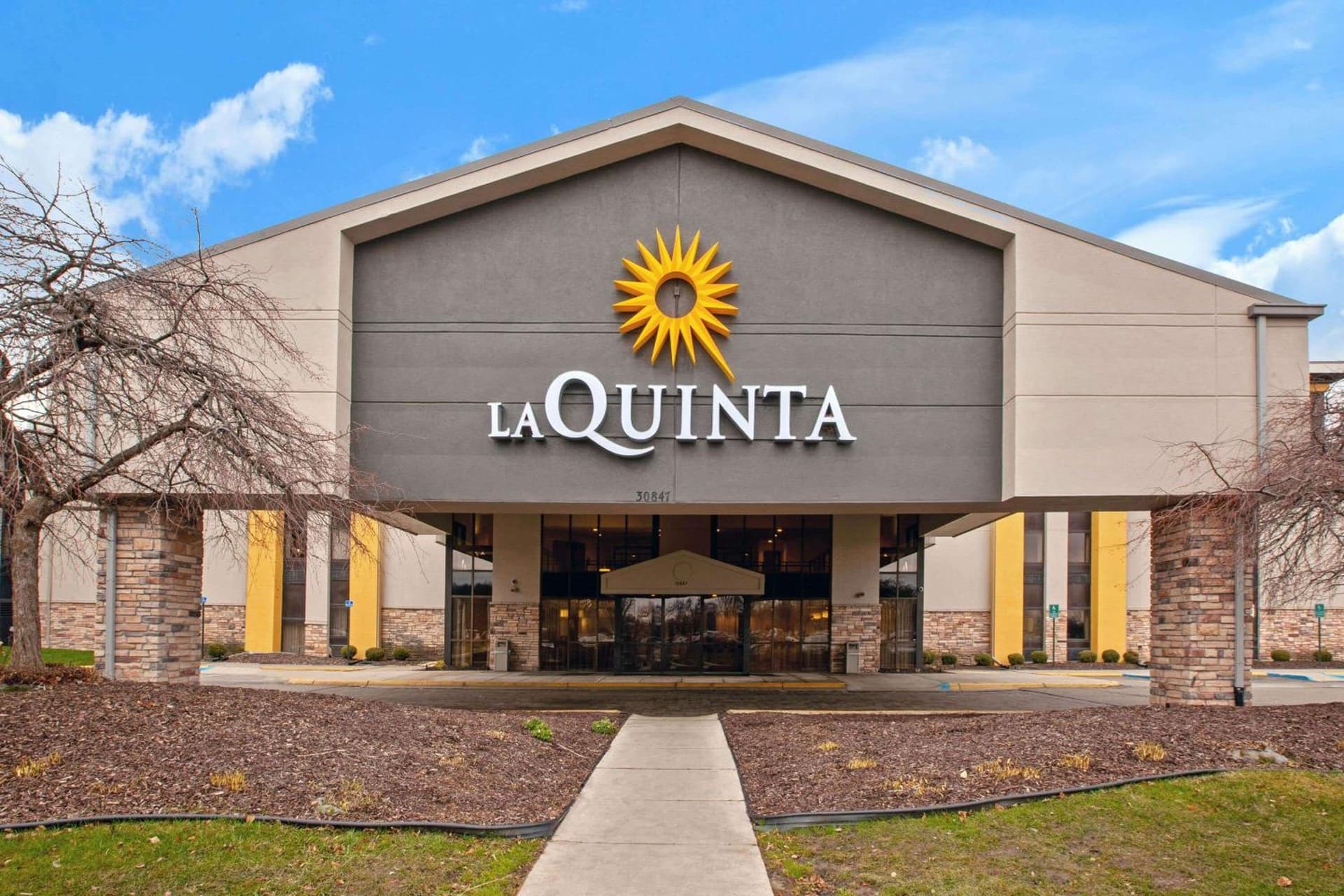 La Quinta Inn & Suites by Wyndham Detroit Metro Airport exterior or lobby in Romulus, MI — main listing photo